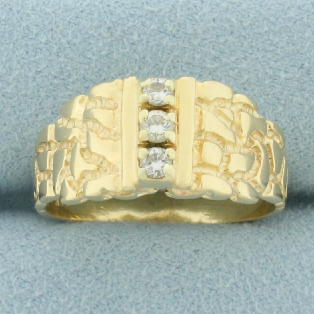 Mens Nugget Style Three Stone Diamond Ring in 14k Yellow Gold: In 14k Yellow Gold. Contains three high quality diamonds, 1/4ct TW, VS clarity/G color. 10mm wide at center. Size 11. 6.9g.