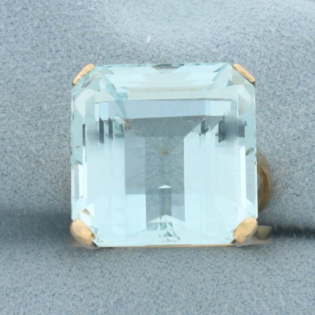 AAA Aquamarine Solitaire Ring in 18k Yellow Gold: In 18k Yellow Gold. Contains one AAA quality 16.8x16.4mm natural Aquamarine gemstone, approximately 22cts, with rich intense color and excellent clarity. Size 7.5. 9.4g.
