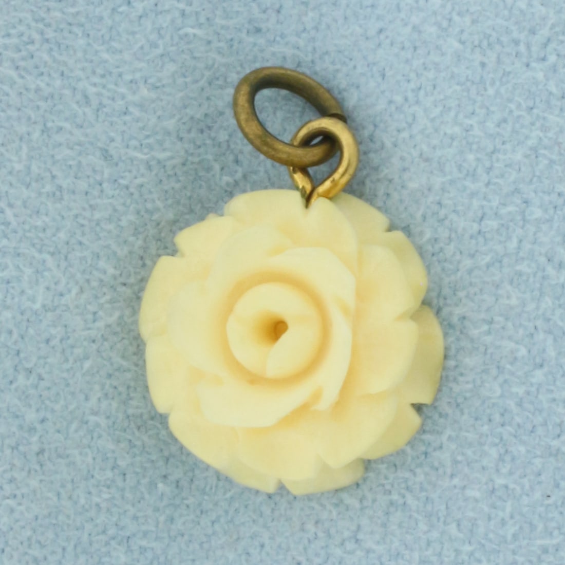 Hand Carved Bone Antique Charm in Gold Plate: In Gold Plate. 3/4 inch long (including jump ring). 1/2 inch wide. 1.0g.