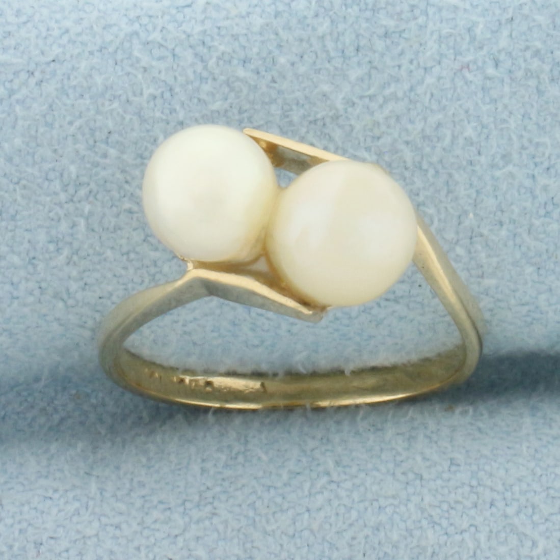 Cultured Pearl Toi et Moi Bypass Ring in 10k Yellow Gold: In 10k Yellow Gold. Contains one 6mm and one 5.6mm high quality cultured pearls with high luster. Size 4.5. 1.7g.
