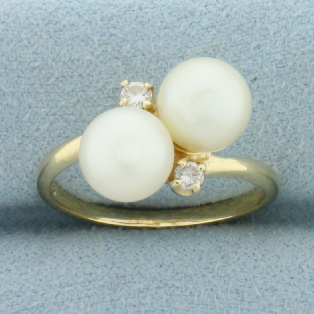 Akoya Pearl and Diamond Toi et Moi Ring in 14k Yellow Gold: In 14k Yellow Gold. Contains two high quality 7.5mm cultured akoya pearls with high luster. Also contains two .03ct high quality diamonds, SI clarity/H color. Size 7.5. 4.1g.