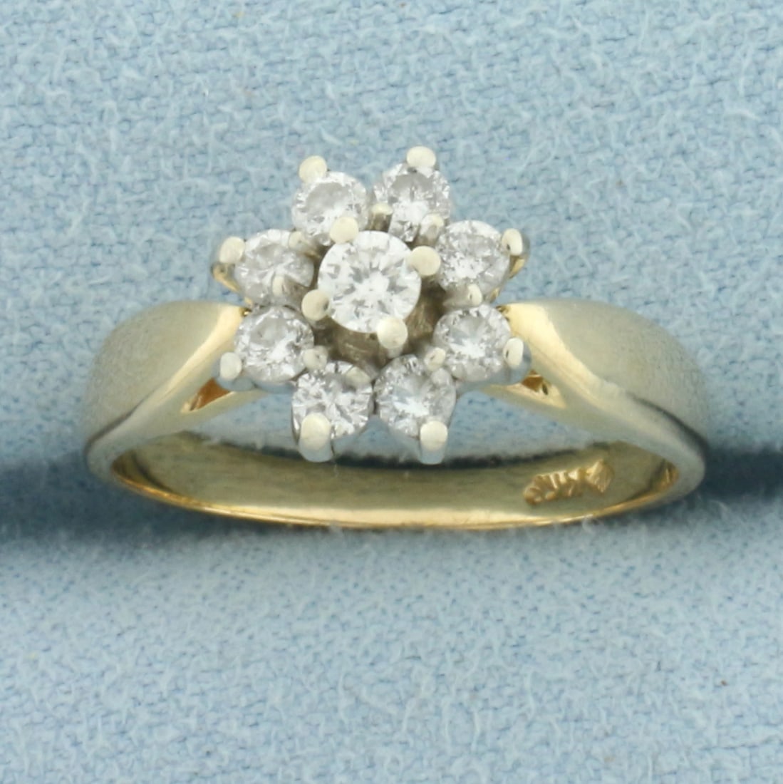 Flower Design Diamond Ring in 14k Yellow Gold: In 14k Yellow Gold. Contains nine high quality diamonds, 1/2ct TW, H color/I1 clarity. 9mm wide at center. Size 6. 3.5g.