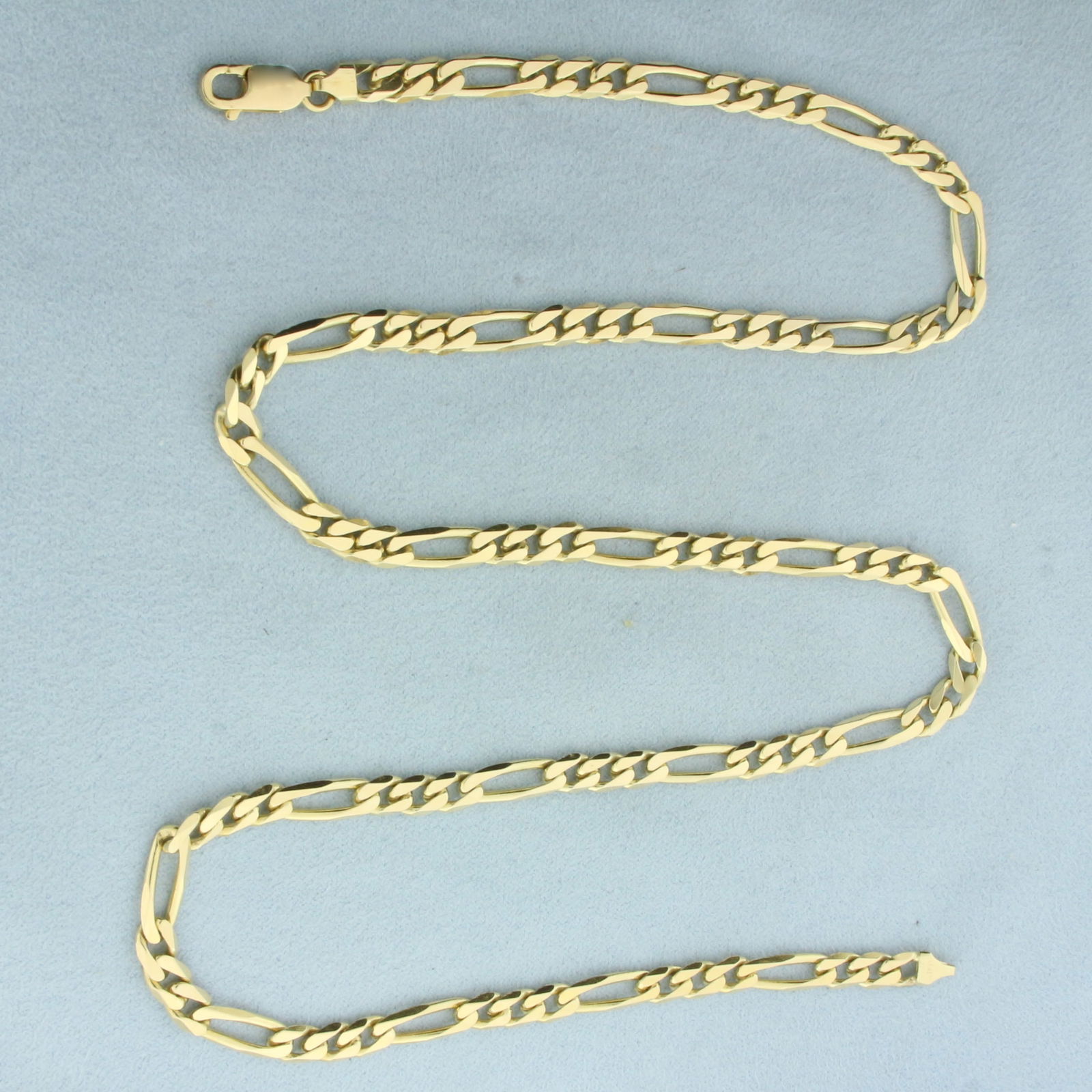 Italian 24 Inch Figaro Link Chain Necklace in 14k Yellow Gold: In 14k Yellow Gold. 24 inches long. 5.3mm wide. Made in Italy. Lobster clasp. 34.8g.