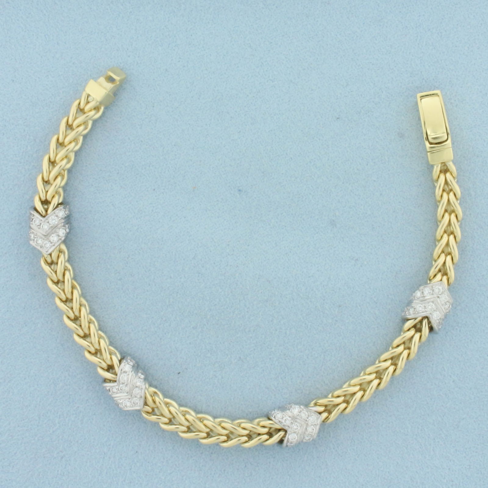 Italian Diamond Chevron Foxtail Bracelet in 14k Yellow Gold: In 14k yellow gold. Contains fifty-six high quality diamonds, 1ct TW, VS clarity/G color. Italian made. 7 inches long and 8mm wide, (at widest point). Slide in clasp. 31.3g.