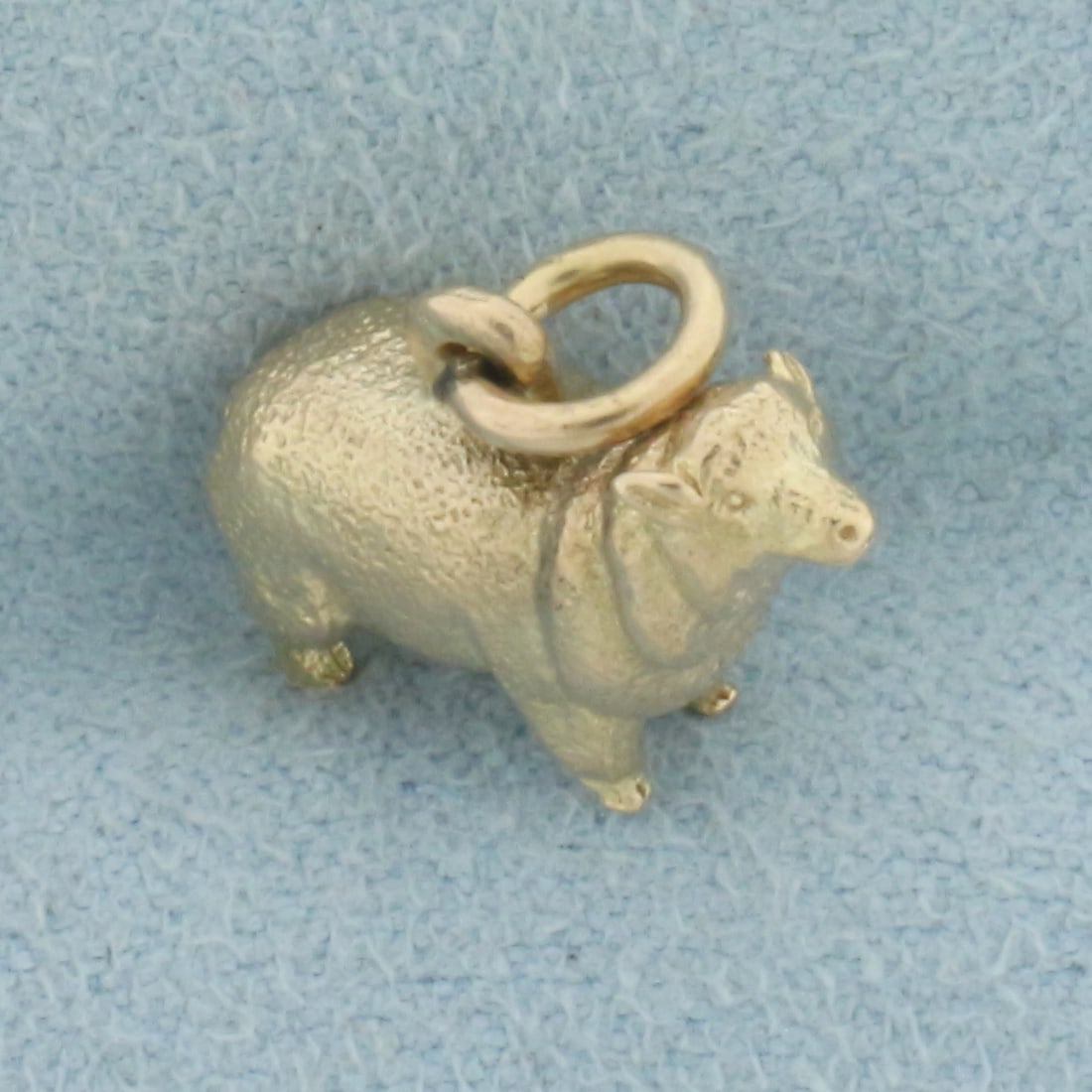 Sheep Charm in 14k Yellow Gold: In 14k Yellow Gold.5/8 inch tall (including jump ring). 5/8 inch wide. 4.0g.
