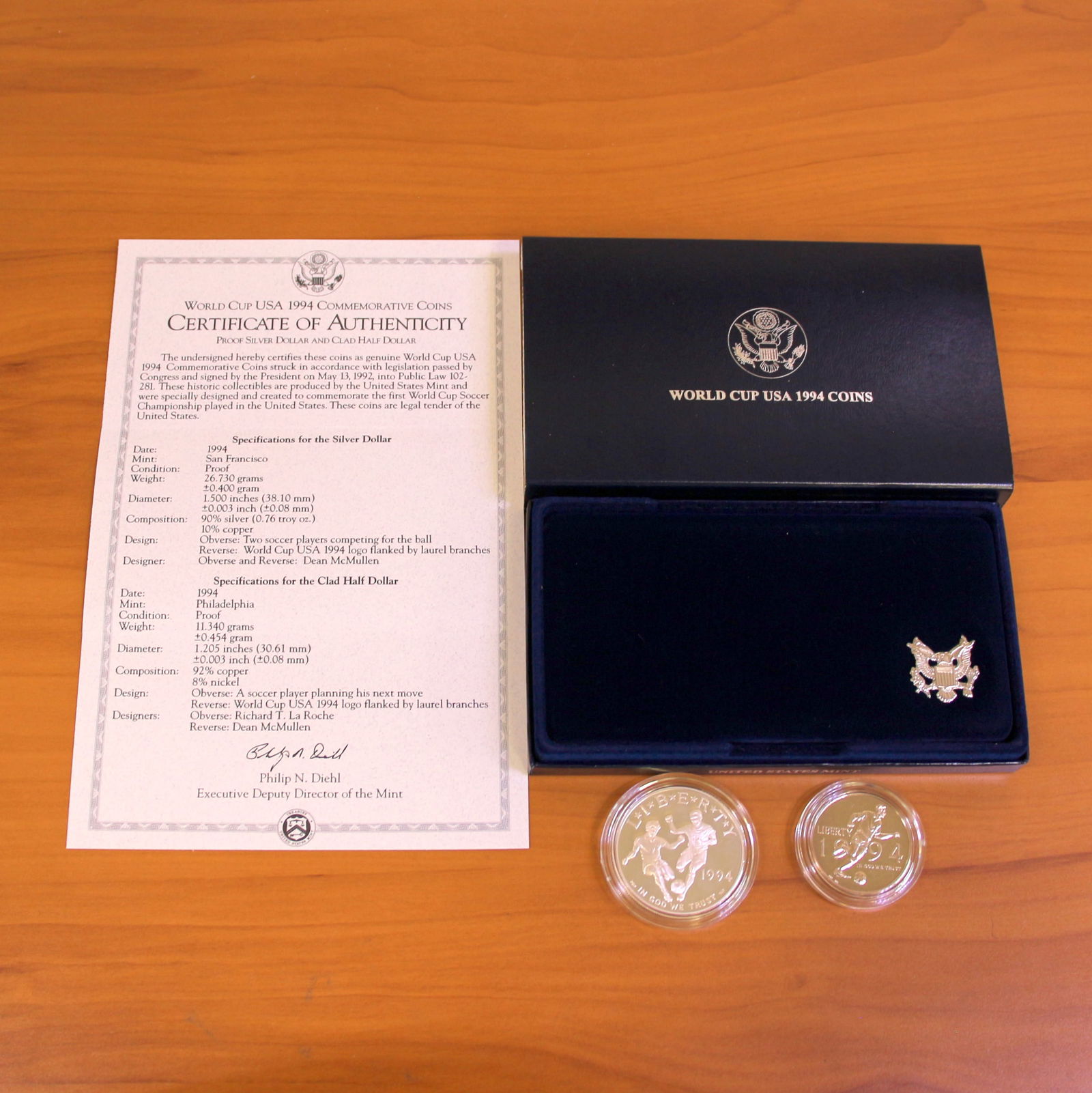 US Mint World Cup USA Silver Proof Coin Set OGP: Contains one 1994 United States 90% Silver Commemorative Silver Dollar. Also contains one 1994 Clad Half Dollar. Set in original packaging and contains certificate of authenticity.