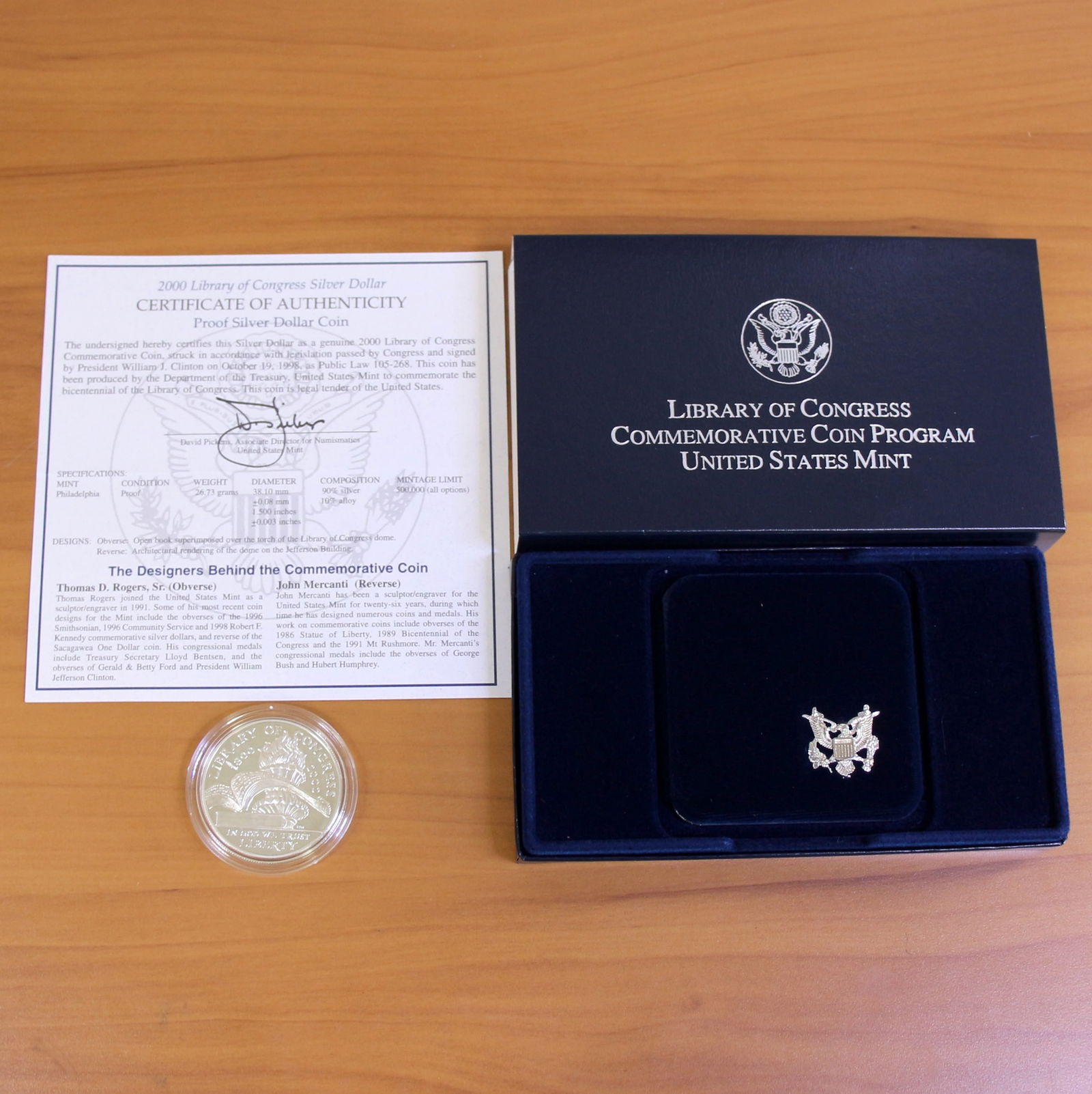 US Mint Library of Congress Silver Dollar Proof Coin OGP: Contains one 2000 United States 90% Silver Commemorative Silver Dollar. Set in original packaging and contains certificate of authenticity.
