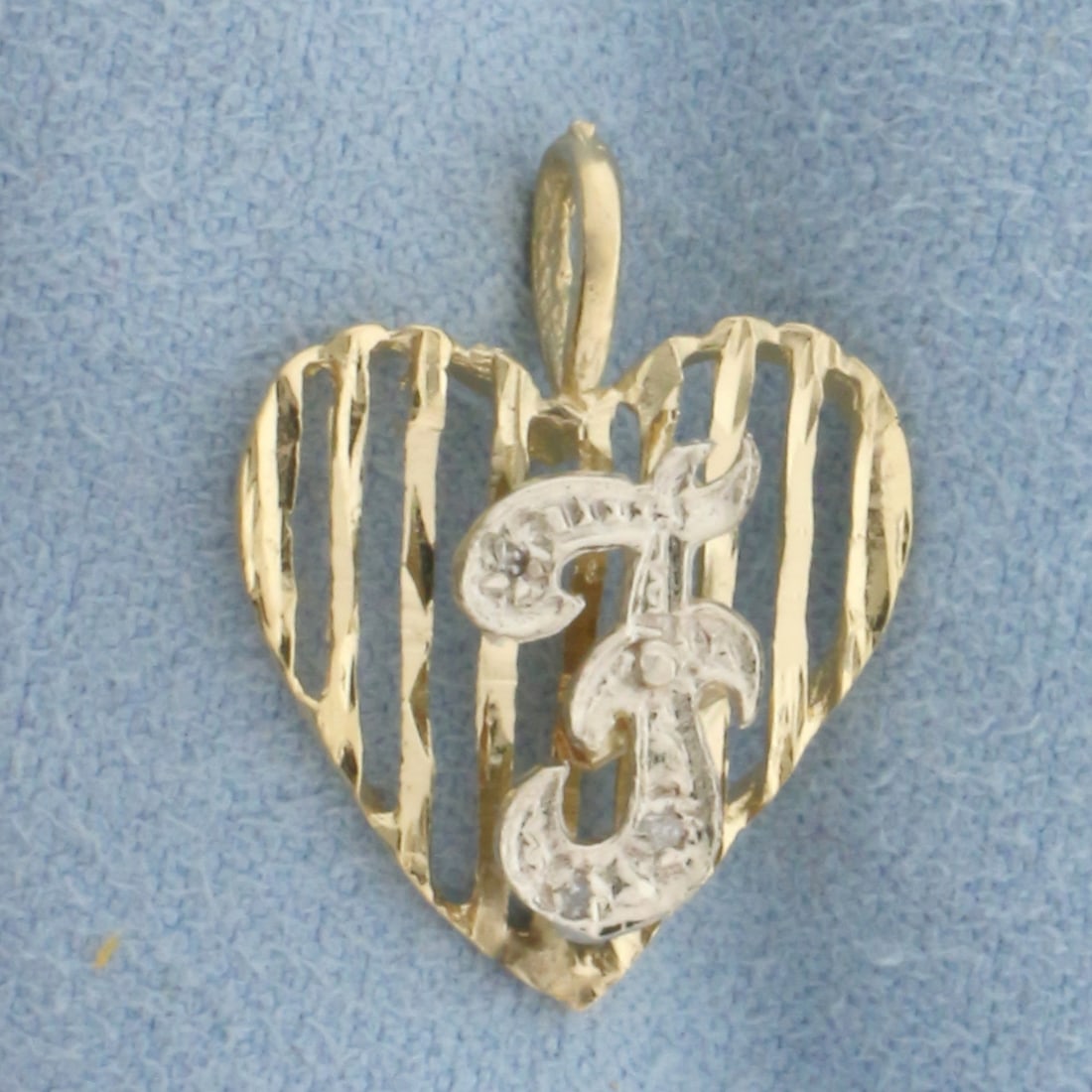 Diamond F Monogram Initial Heart Pendant in 14k Yellow Gold: In 14k Yellow Gold. Contains three high quality 1/2pt diamonds. 3/4 inch long. 5/8 inch wide. 1.4g.