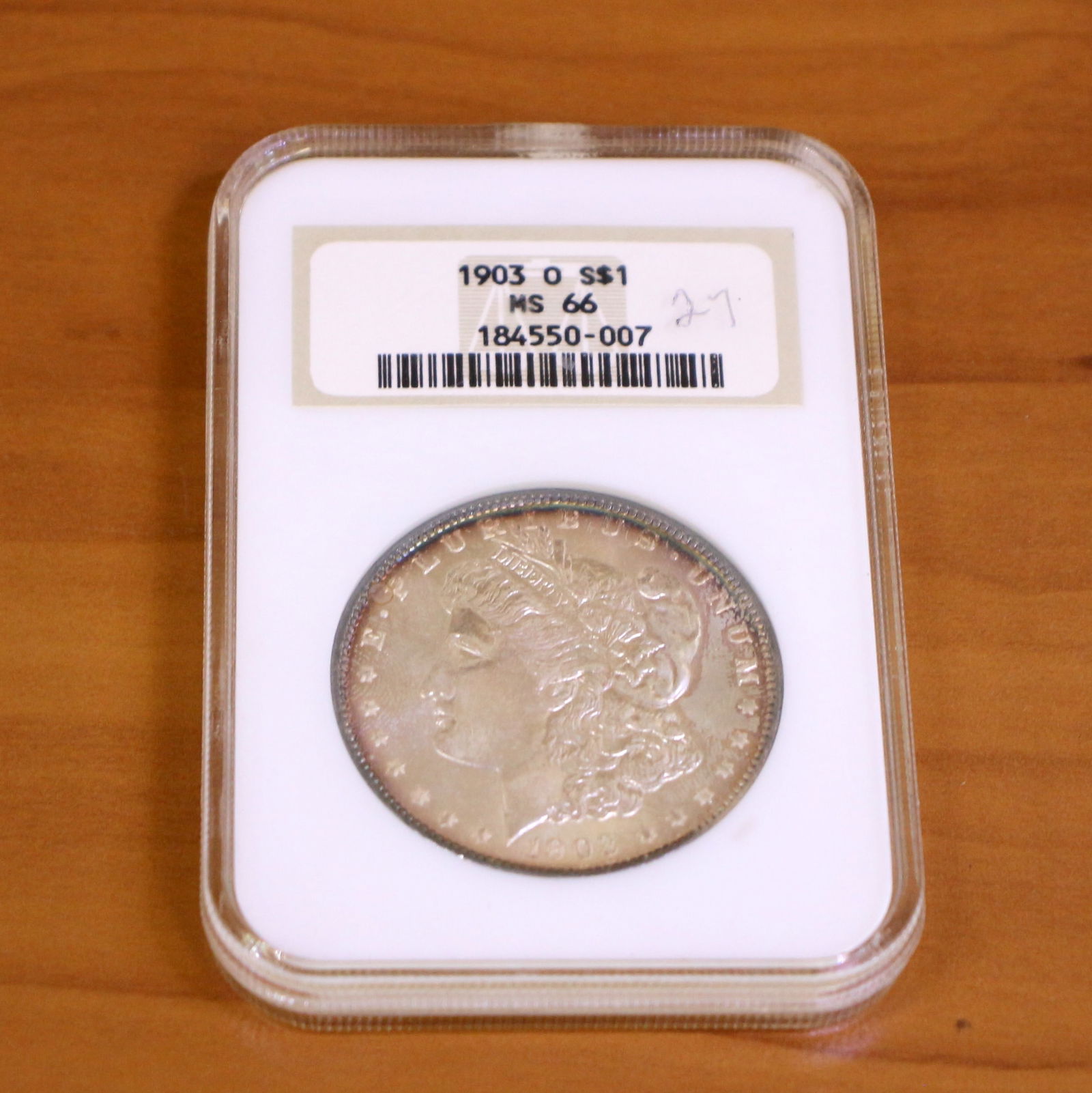 NGC 1903-O MS66 Morgan Silver Dollar Coin: Contains one 1903-O MS66 Morgan Silver Dollar. Packaged by NGC.