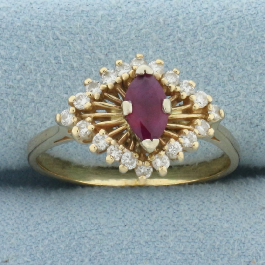 Ruby and Diamond Evil Eye Ring in 14k Yellow Gold: In 14k Yellow Gold. Contains one 8mm high quality natural Ruby gemstone with intense color and excellent clarity. Also contains twenty .02ct high quality diamonds, SI clarity/H color. 13mm wide at