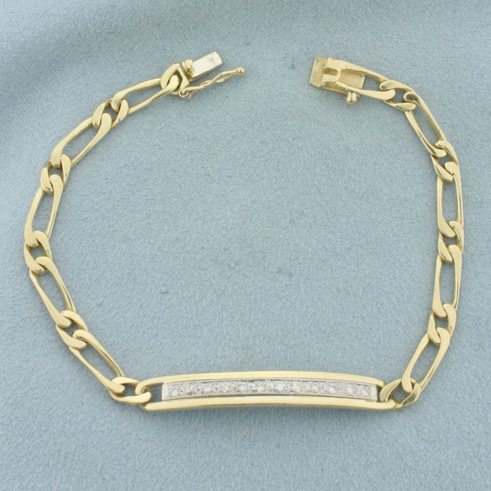 Diamond Bracelet in 14k Yellow Gold: In 14k Yellow Gold. Contains twelve high quality diamonds, 1/4 ct TW, SI clarity/H color. 7 3/8 inches long. 1/4 inch wide (at center). Slide clasp with safety latch. 10.7g.