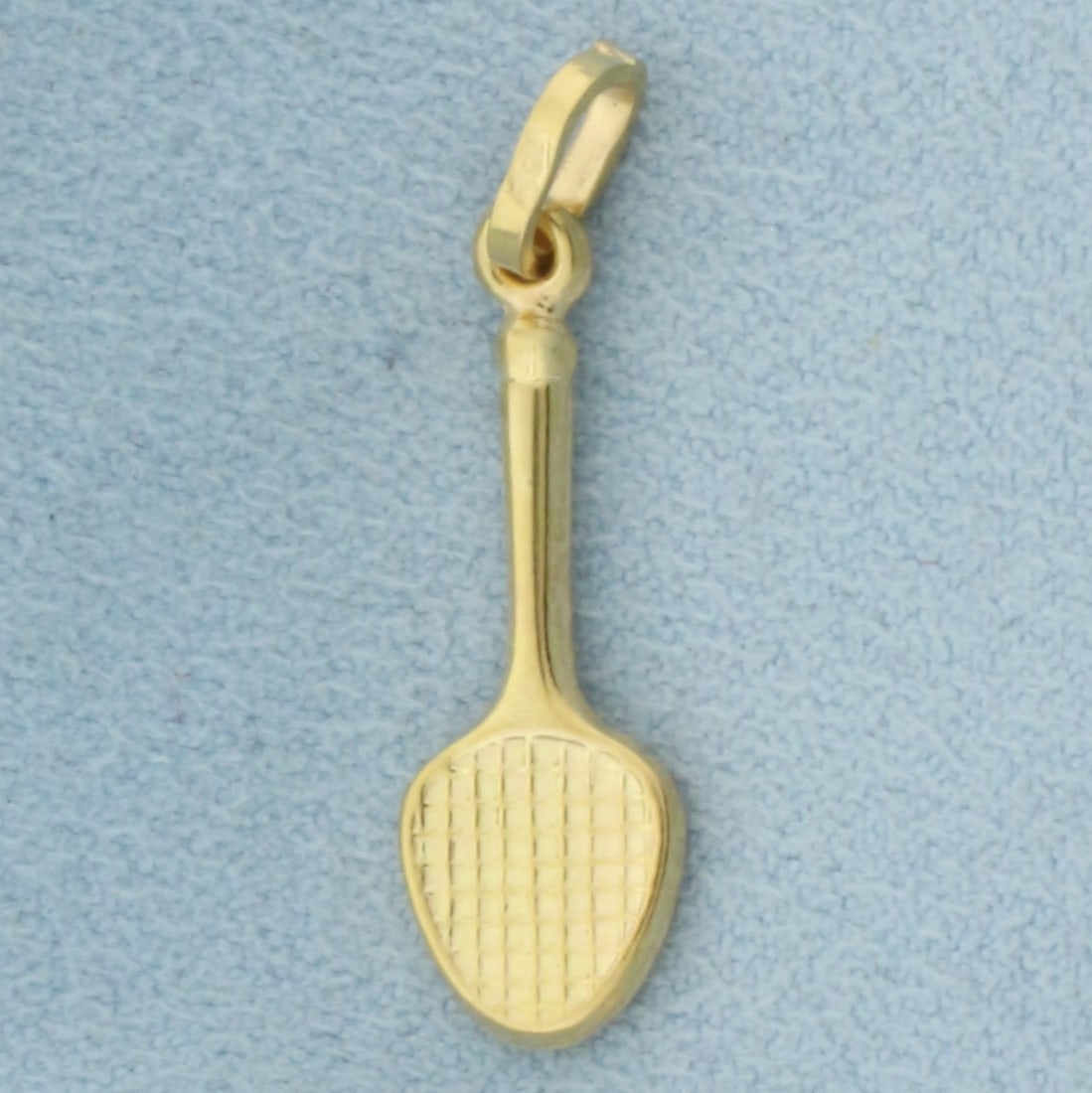 Tennis Racket Pendant in 18k Yellow Gold: In 18k Yellow Gold. 1 1/8 inch long (including bale). 3/8 inch wide. 1.3g.