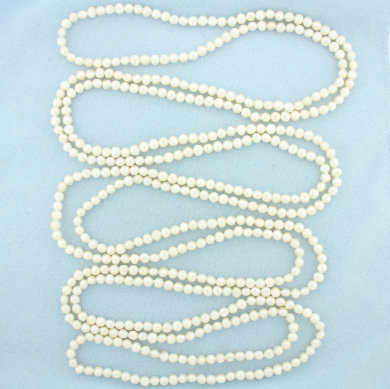100 Inch Long Cultured Pearl Strand Necklace: Contains 5-6mm high quality Cultured Pearls with high luster. 100 inches long.
