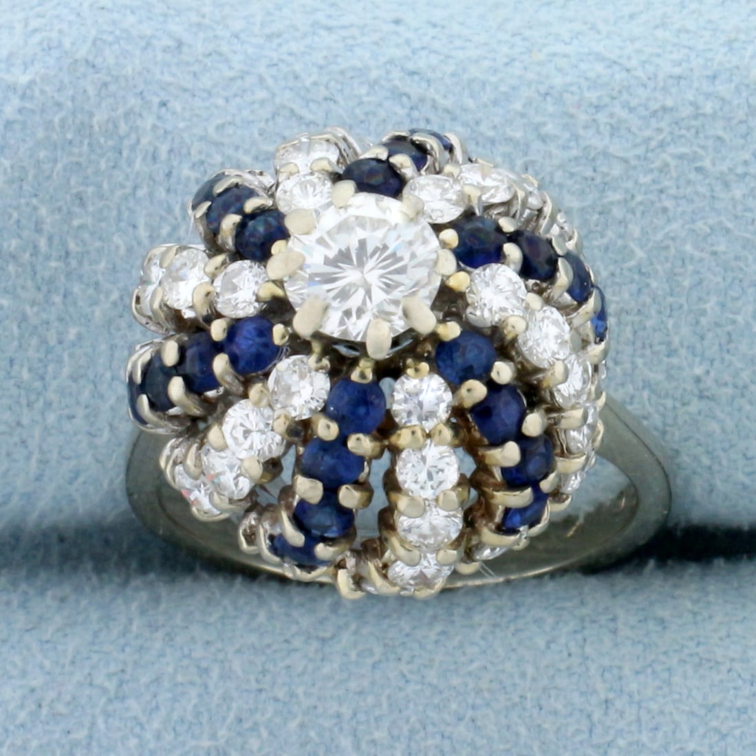 Unique Sphere Design 2 1/2ct Diamond and Sapphire Ring in 14k White Gold: In 14k white gold. Contains a high quality round brilliant center diamond, .55ct F color/SI1 clarity. Surrounded by 1.2ct TW of similar high quality diamonds and 3/4ct TW of high quality natural