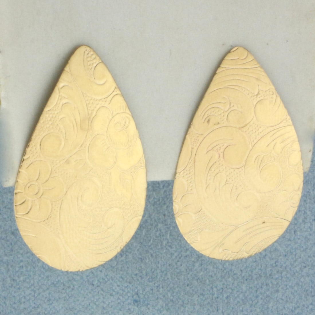 Etched Large Pear Shaped Earrings in 14k Yellow Gold: In 14k Yellow Gold. 1 inch long. 5/8 inch wide at widest. Friction backs. 1.9g.