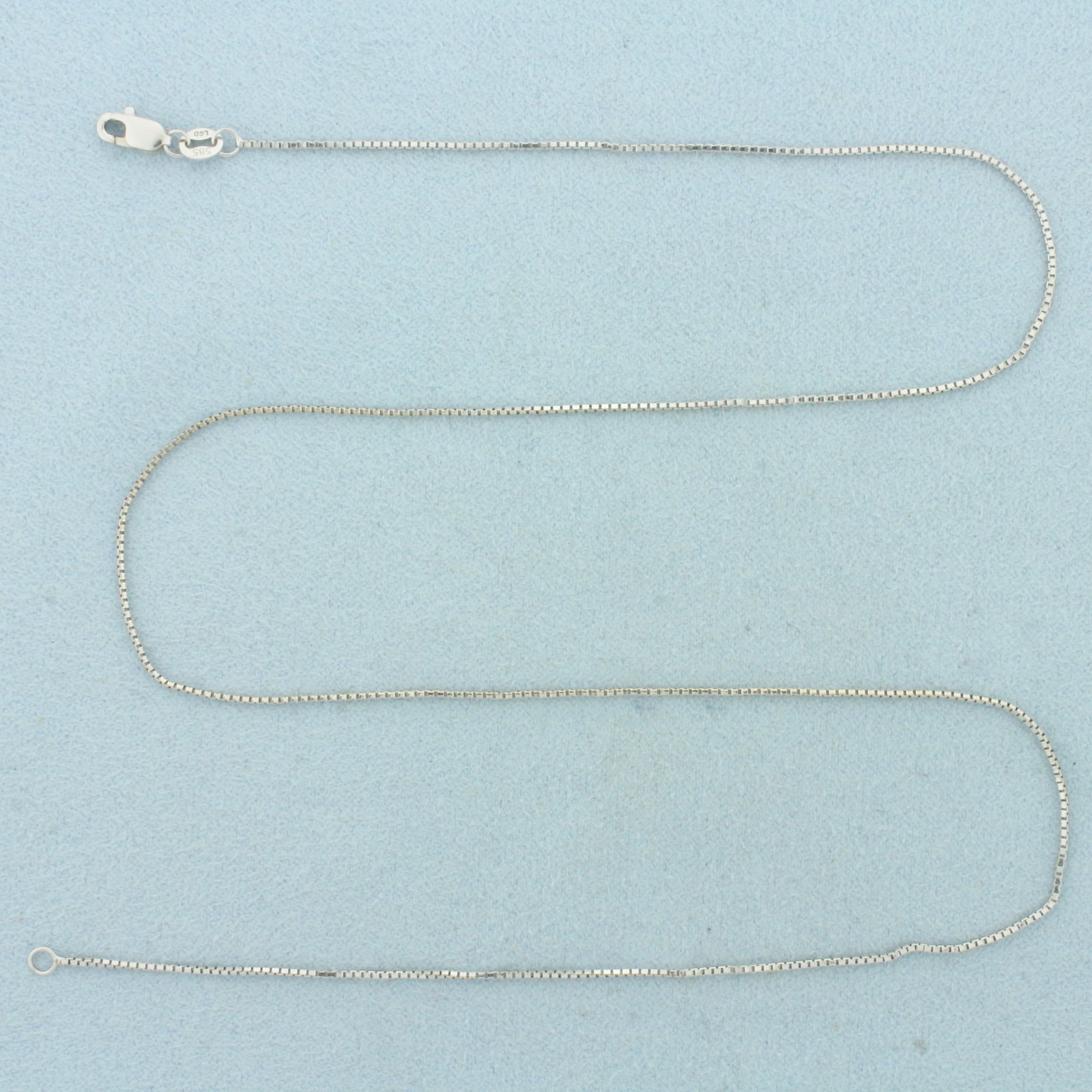 17 Inch Box Link Chain Necklace in 14k White Gold: In 14k White Gold. 17 inches long. 0.8mm wide. Lobster clasp. 1.9g.