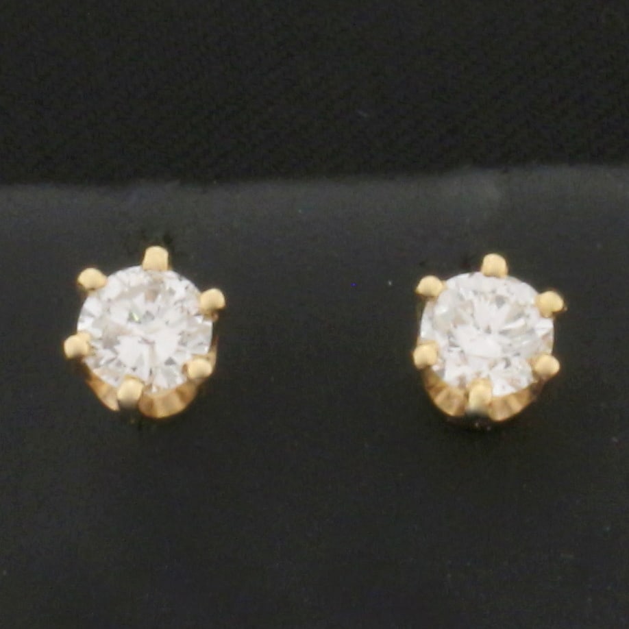 1/2ct TW Diamond Stud Earrings in 14k Yellow Gold Settings: In 14k Yellow Gold. Contains two high quality 1/4ct round brilliant diamonds, 1/2ct TW, SI2 clarity/H color, great cut for added brilliance, eye clean. 6-prong basket setting. Friction backs. 0.9g.