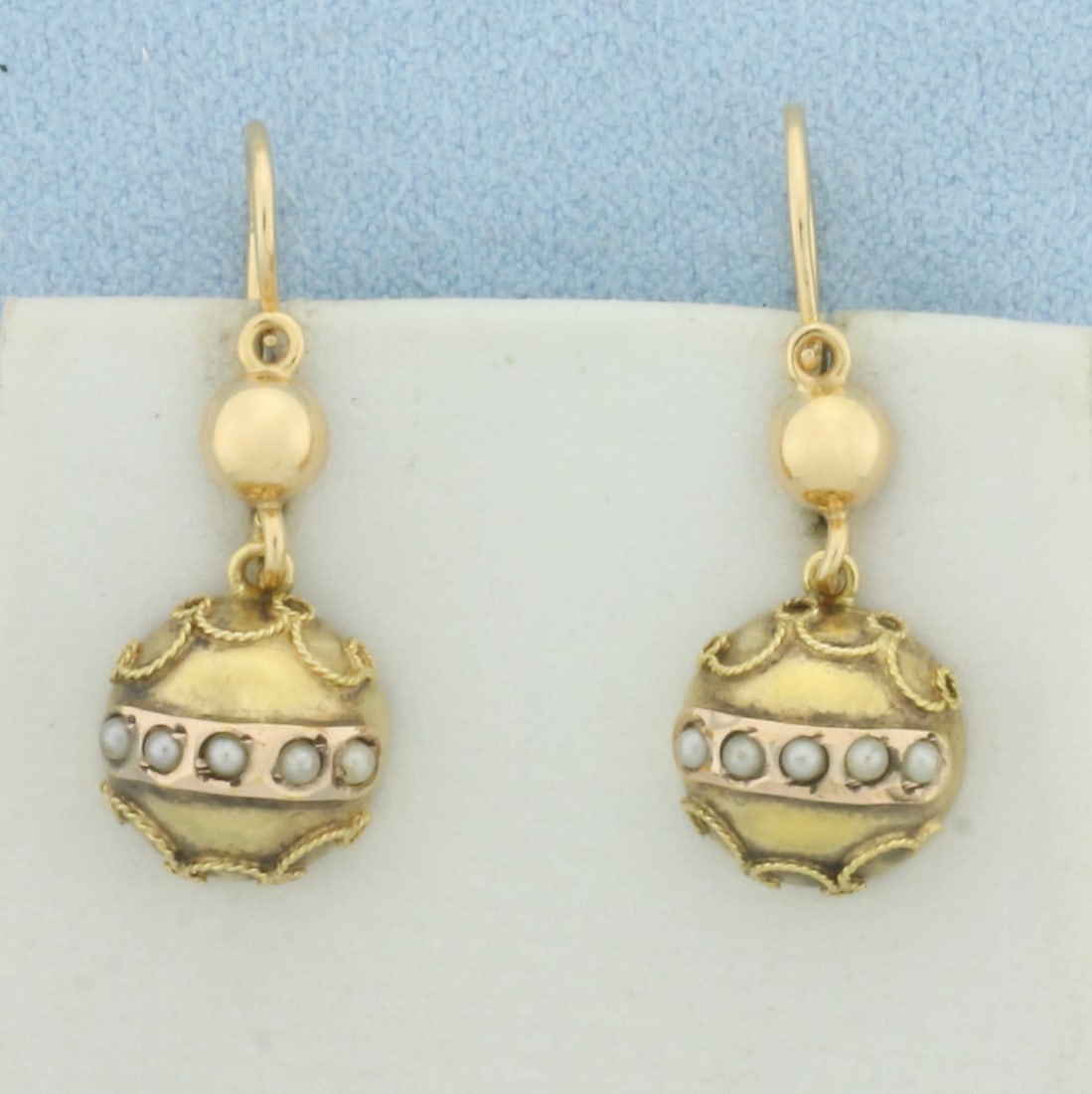 Vintage Pearl Dangle Earrings in 18k Yellow Gold: In 18k Yellow Gold. Contains ten high quality 1.5mm seed pearls. 1 inch long. 2.6g.