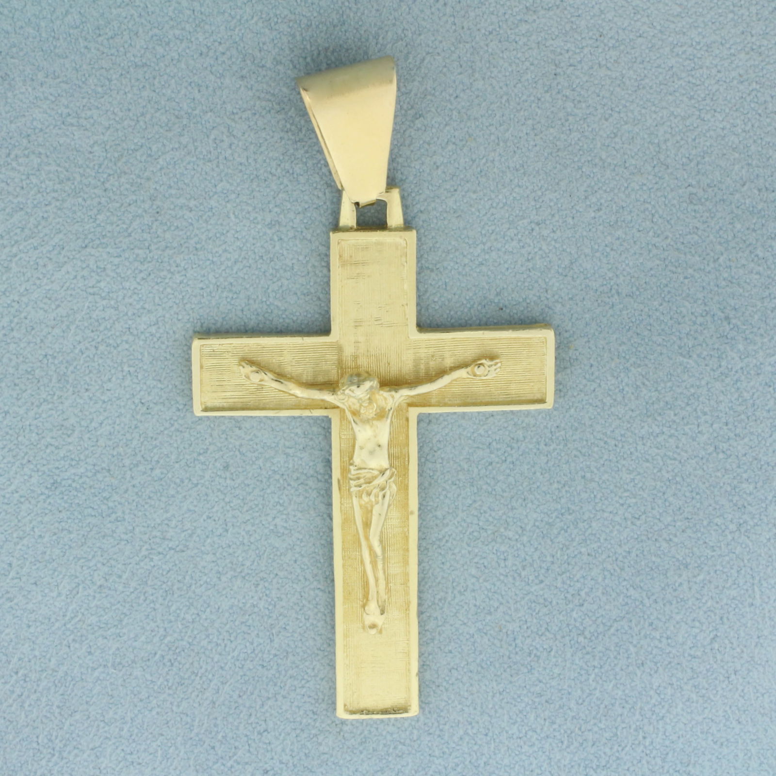 Large Crucifix Cross Pendant in 14k Yellow Gold: In 14k Yellow Gold. 2 3/8 inch long (including bale). 1 1/4 inch wide. 8.2g.