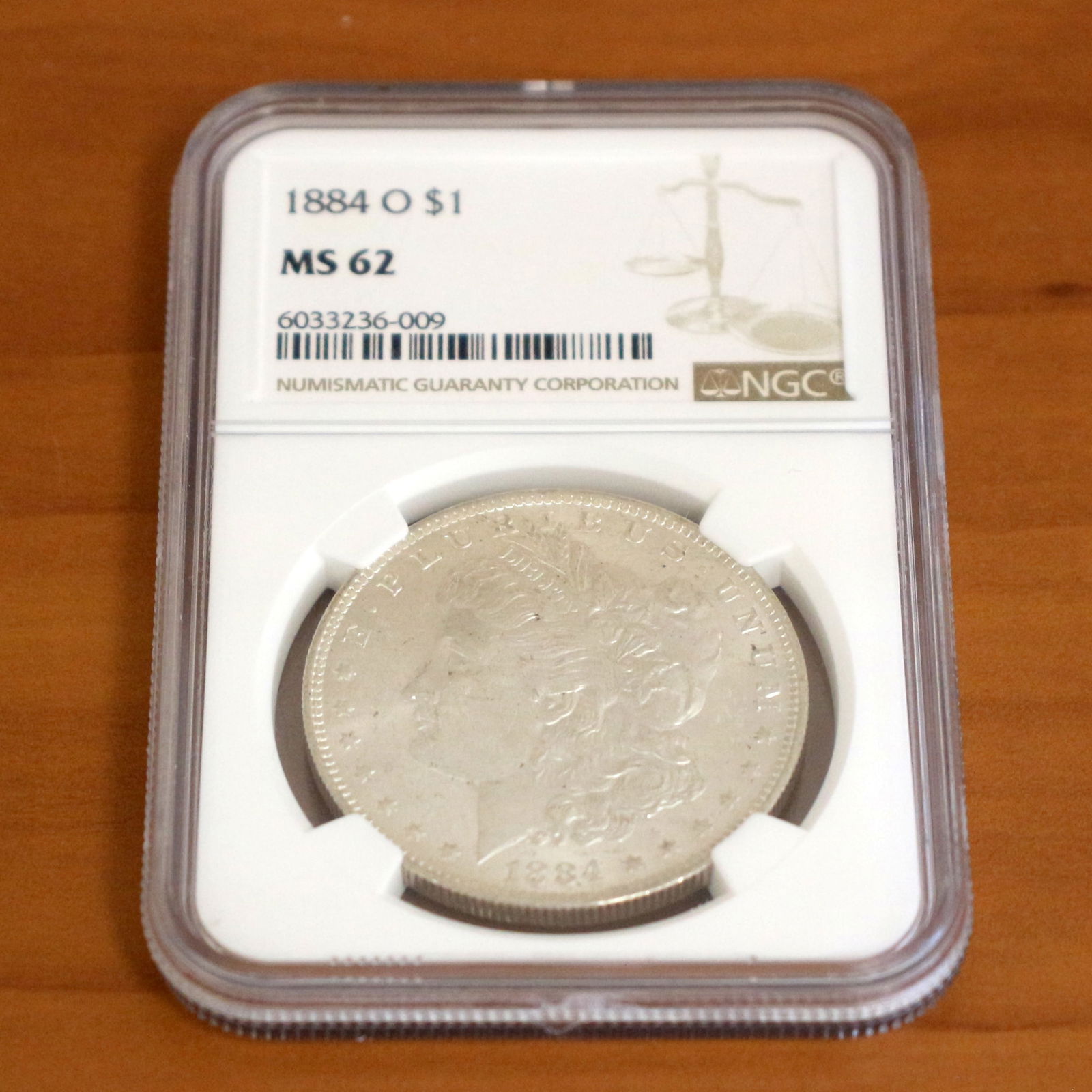 NGC 1884-O MS62 Morgan Silver Dollar Coin: Contains one 1884 MS62 Morgan Silver Dollar. Packaged by NGC.
