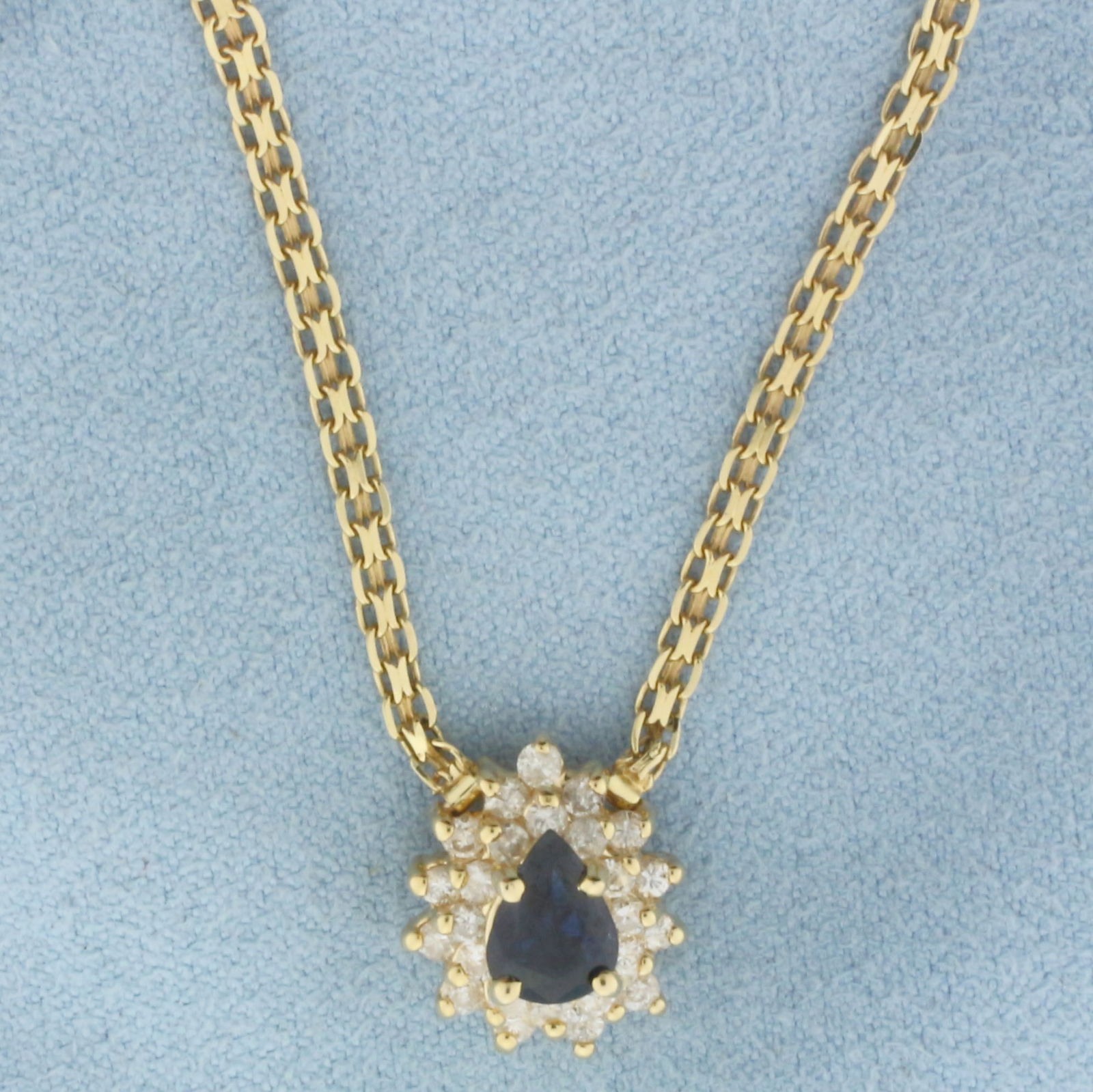 Sapphire and Diamond Necklace in 14k Yellow Gold: In 14k Yellow Gold. Contains one 7mm high quality natural Sapphire gemstone, approximately 3/4ct, with intense color and excellent clarity. Also contains twenty-five .02ct high quality diamonds, SI