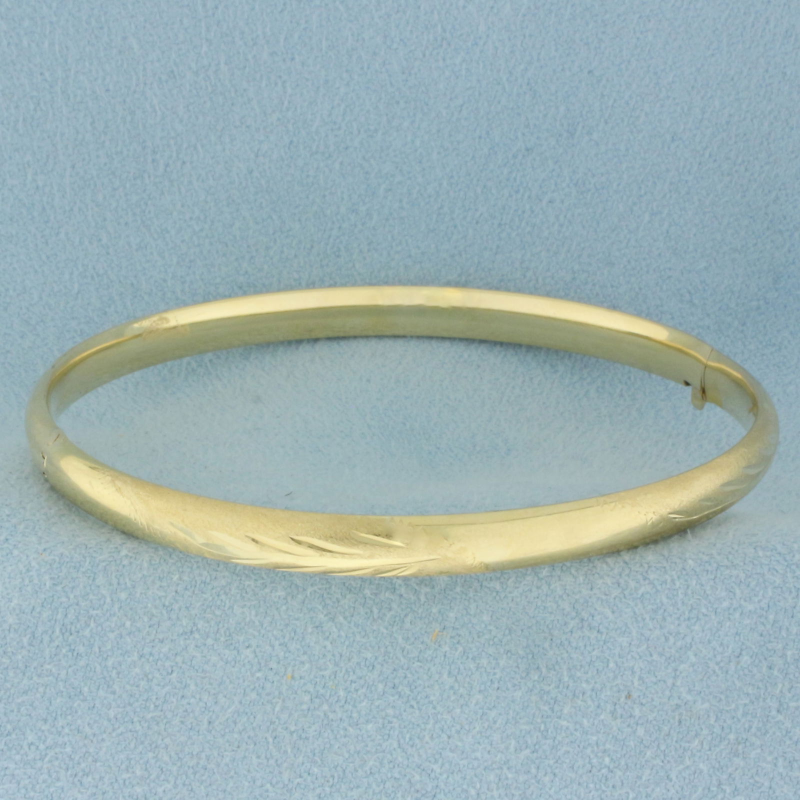Leaf Nature Design Hinged Bangle Bracelet in 14k Yellow Gold: In 14k Yellow Gold. Interior dimensions: 2 1/4 x 2 1/8 inches. Opens/closes for easy taking on/off. 5.0g.