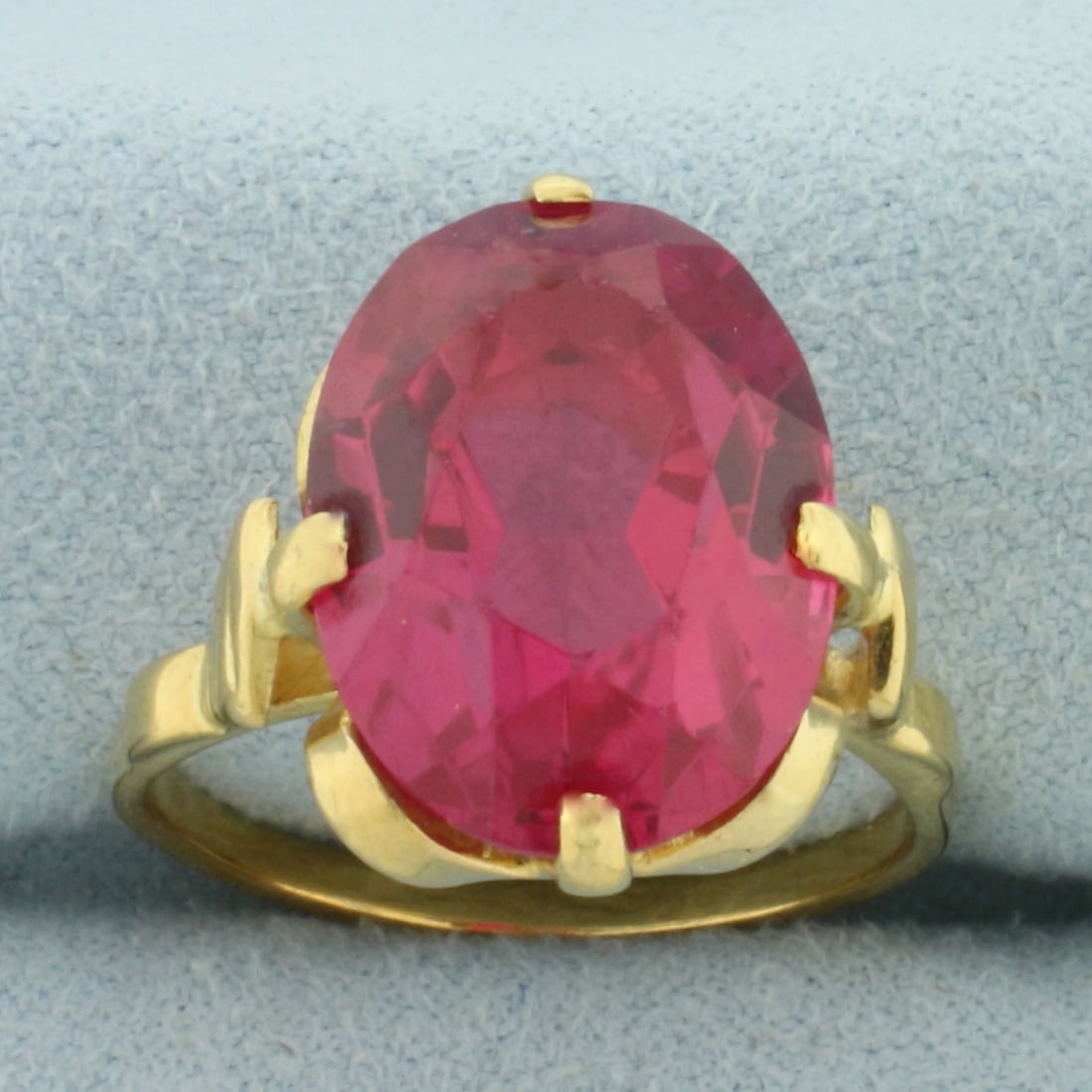 Vintage Lab Ruby Ring in 18k Yellow Gold: In 18k Yellow Gold. Contains one 16x12mm high quality Lab created Ruby gemstone, approximately 12cts, with vibrant color and excellent clarity. Size 8.5. 8.5g.