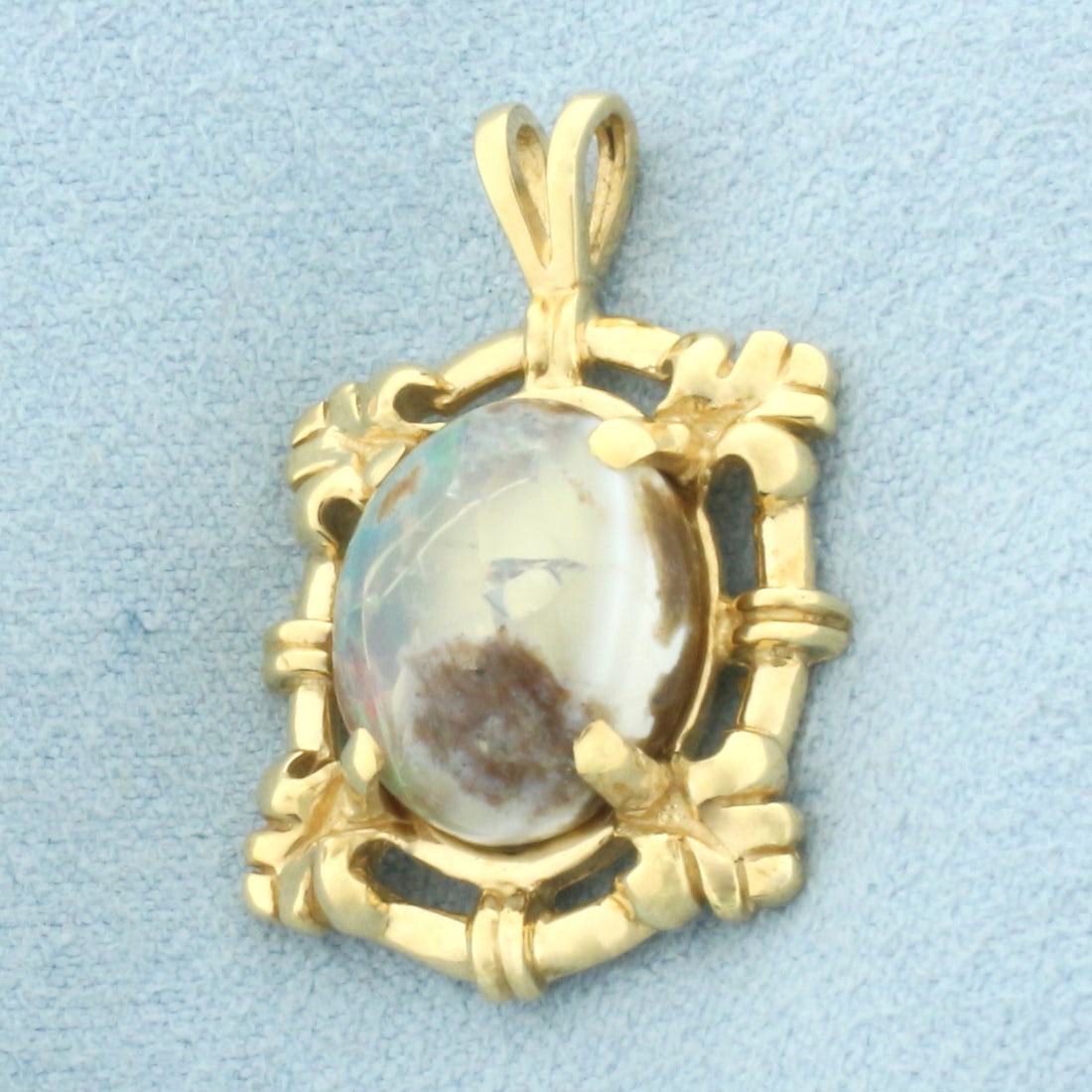 Lodolite Quartz Pendant in 14k Yellow Gold: In 14k Yellow Gold. Contains one 13mm high quality Lodolite gemstone with interesting mineral inclusion characteristics. 1 1/8 inch long. 3/4 inch wide. 4.3g.