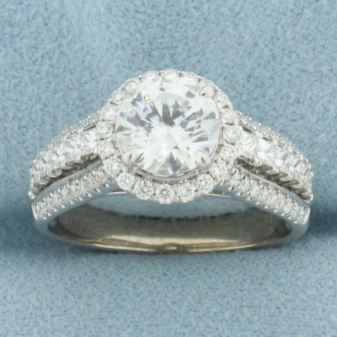 Simon G. Diamond and CZ Halo Engagement Ring in 18k White Gold: In 18k White Gold. Contains one high quality 1.5ct CZ gemstone with excellent cut and clarity for added brilliance. Also contains .94ct TW of accent diamonds VS clarity/G color. 10.3mm wide at