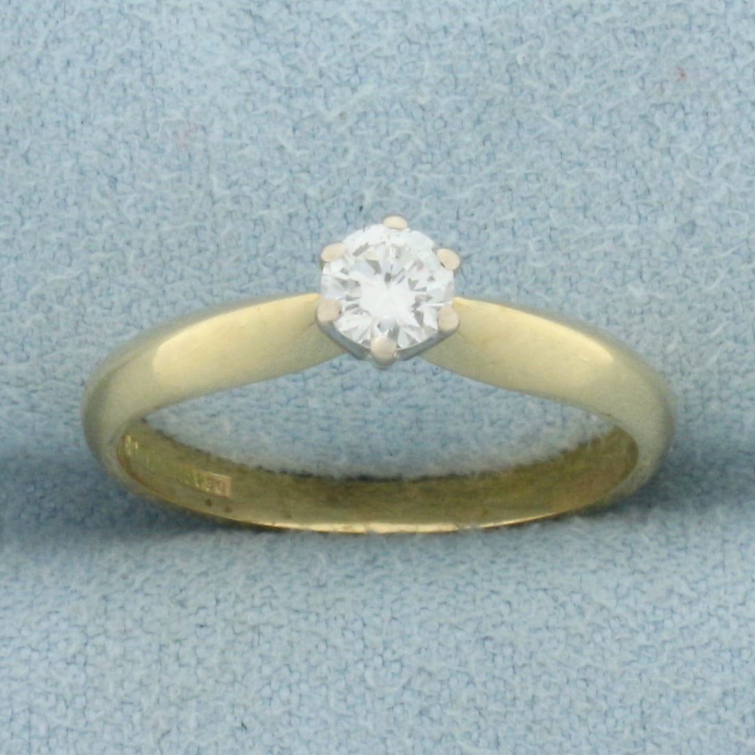 Diamond Solitaire Engagement Ring in 18k Yellow Gold: In 18k Yellow Gold. Contains one .25ct high quality diamond, VS clarity/H color, excellent cut for added brilliance. Size 6.5. 3.2g.