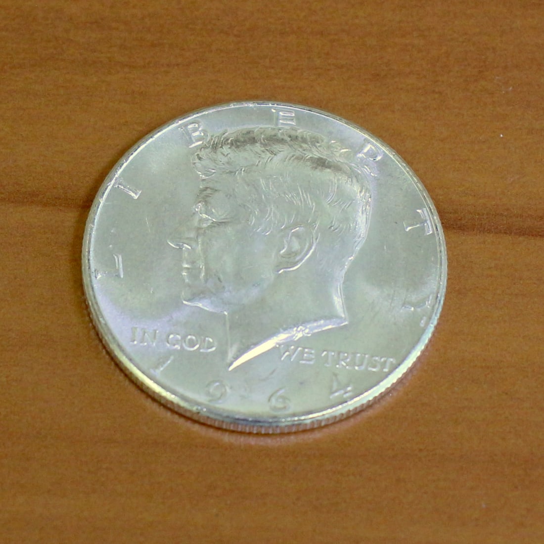 1964 Silver Kennedy Half Dollar Brilliant Uncirculated Very High Luster: Contains one 1964 90% Silver Kennedy Half Dollar. Brilliant Uncirculated, Very High luster.