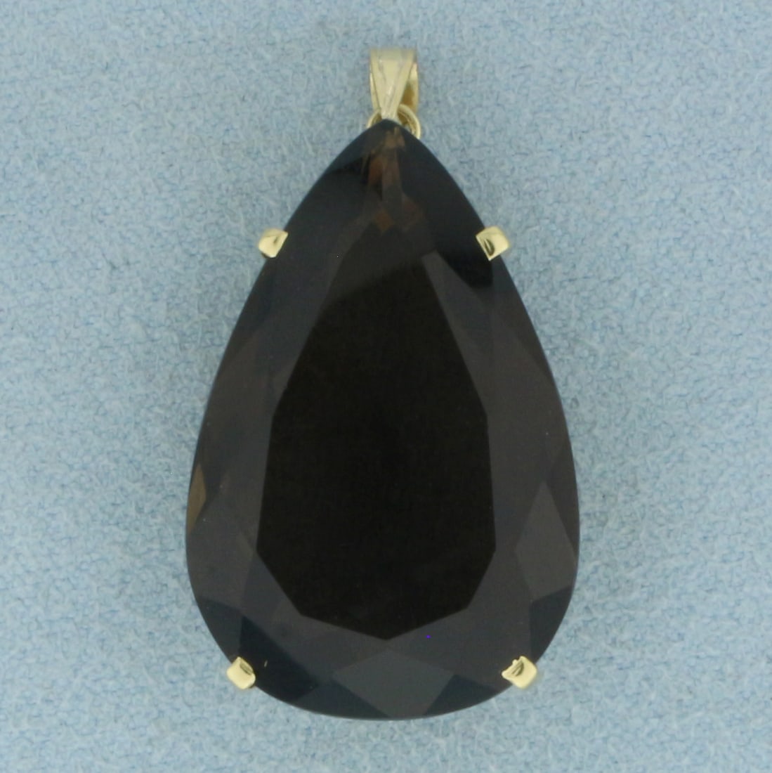 Large 30ct Pear Smoky Topaz Statement Pendant in 18k Yellow Gold: In 18k Yellow Gold. Contains one 28x18mm high quality pear cut natural Smoky Topaz gemstone, approximately 30cts, with intense color and excellent clarity. 1 1/4 inch long. 5/8 inch wide including