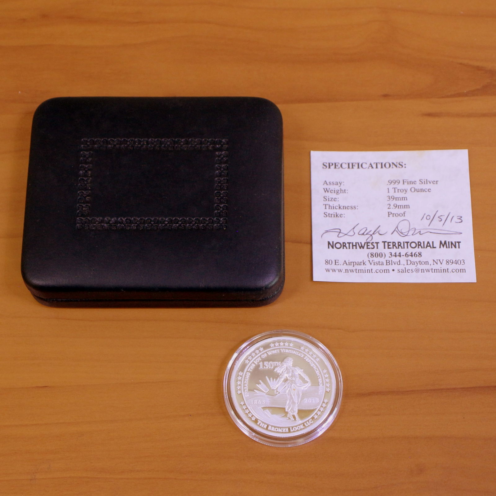 2013 150 Year West Virginia Silver Coin: Contains one 1863-2013 150 Year West Virginia Silver 1oz coin. Packaged by Northwest Territorial Mint and includes Certificate of Authenticity.