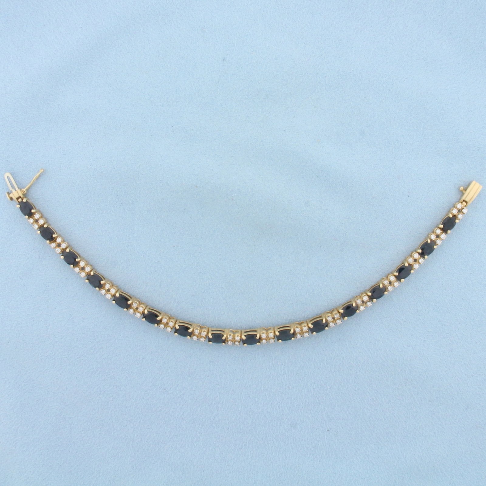 Natural Sapphire and Diamond Tennis Bracelet in 14K Yellow Gold: In 14K Yellow Gold. Contains sixteen high quality natural 6mmx4mm oval cut Sapphire gemstones, 8ct TW, with deep blue color and excellent clarity. Also contains sixty four high quality Diamonds, 1ct T