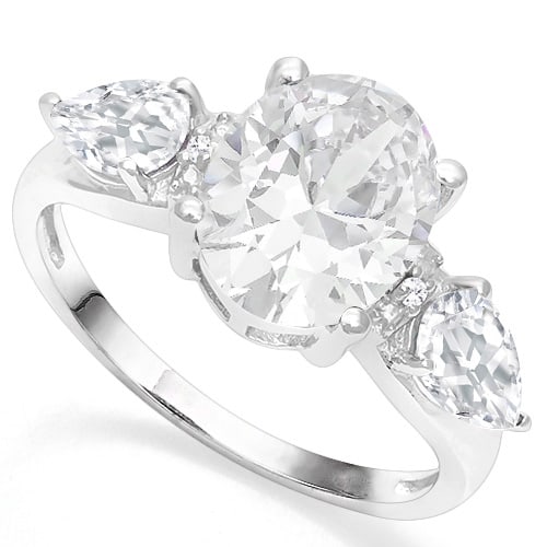 3-Stone White Topaz with Diamond Accent Ring In Sterling Silver: In platinum over .925 sterling silver. Contains one 3.1ct white topaz in the center, accented with two white topaz pear cut gems on the side, 0.9ctw. Also contains two genuine diamonds, .01ctw. Size