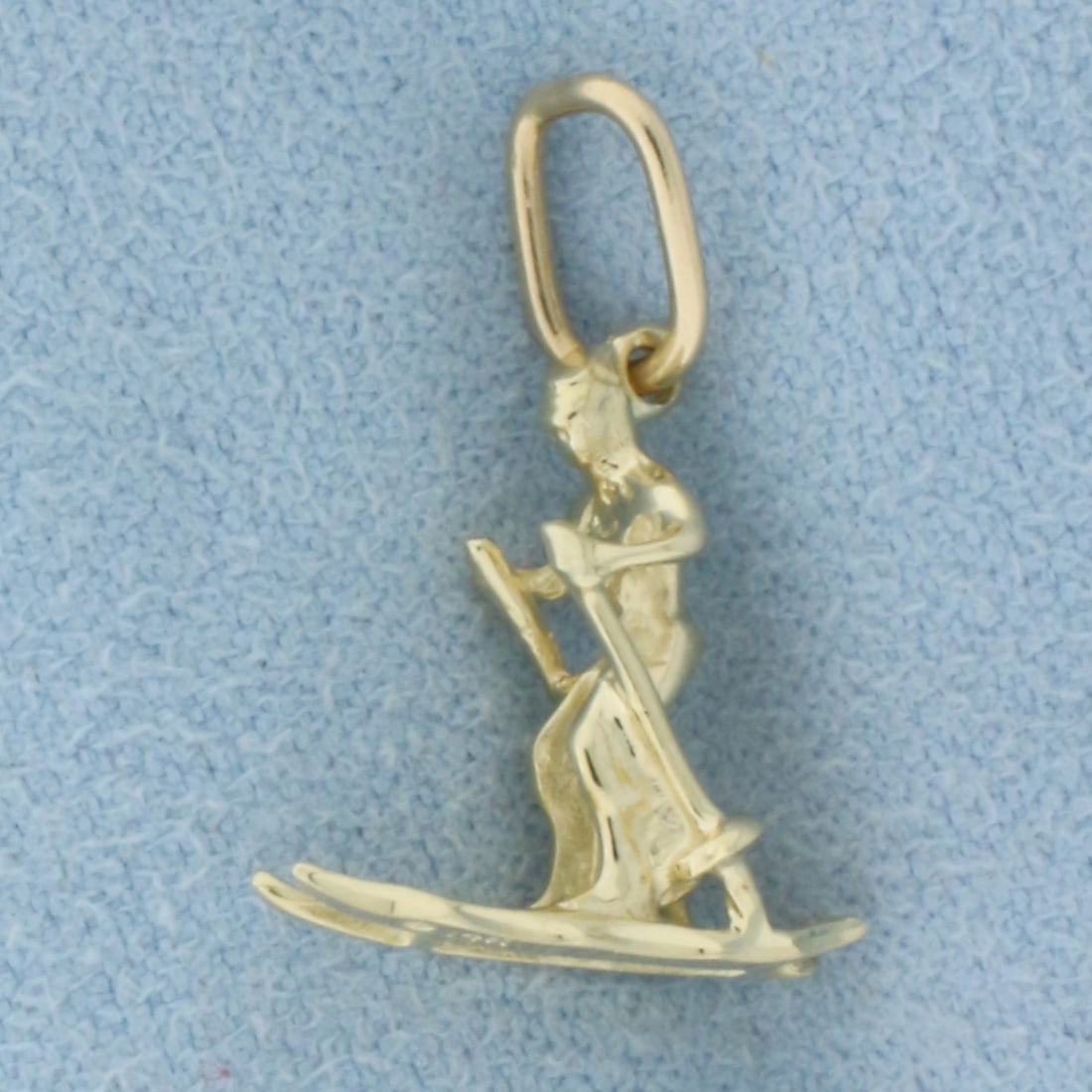 Snow Skiing Pendant or Charm in 14k Yellow Gold: In 14k Yellow Gold. 3/4 inch long including jump ring. 1/2 inch wide. 1.2g.