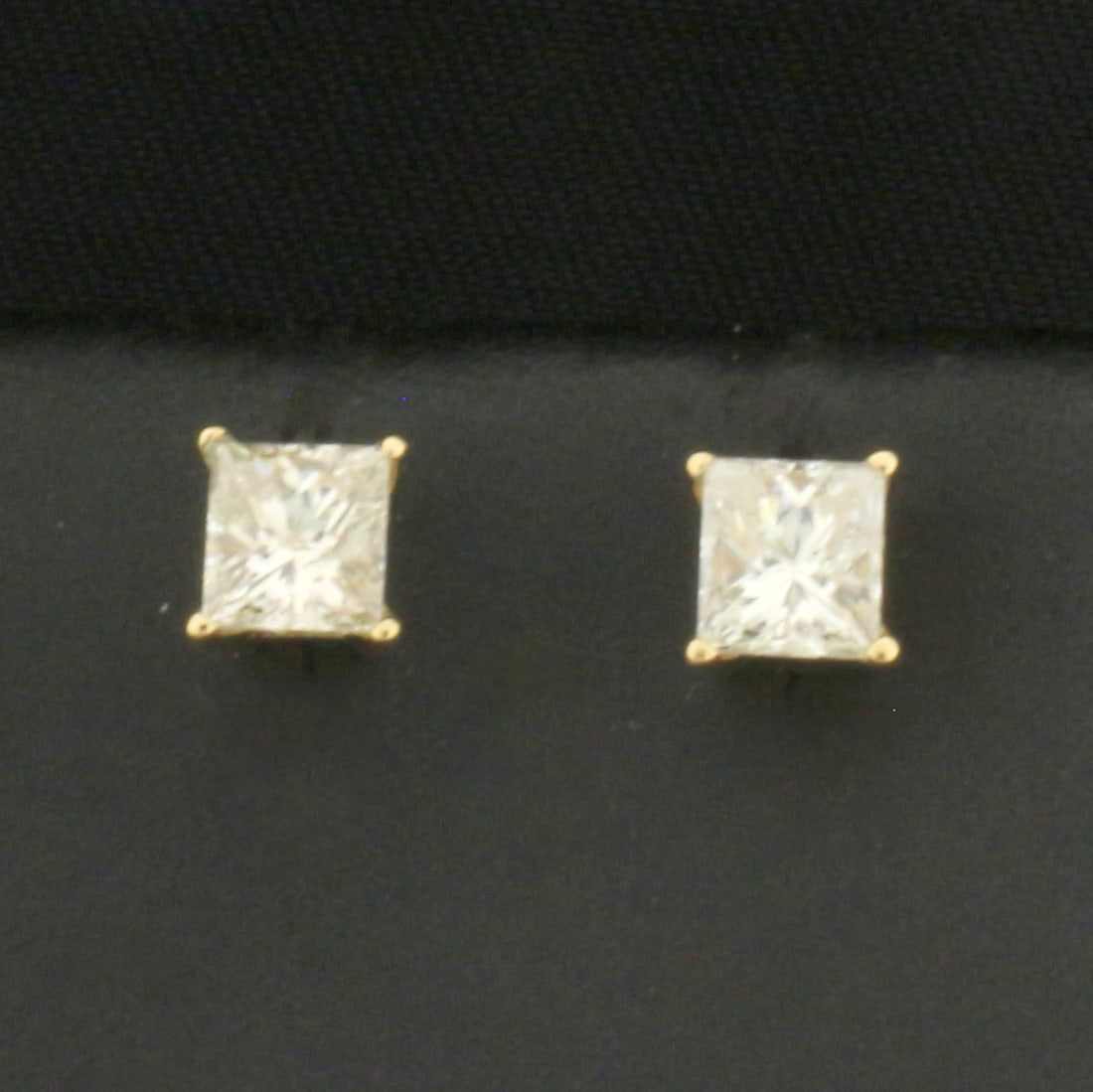 Princess Diamond Stud Earrings in 14k Yellow Gold: In 14k Yellow Gold. Contains two high quality princess cut diamonds, 3/4ct TW, SI2 clarity/H color, eye clean, great cut for added brilliance. Screw post. No backs. .7g.