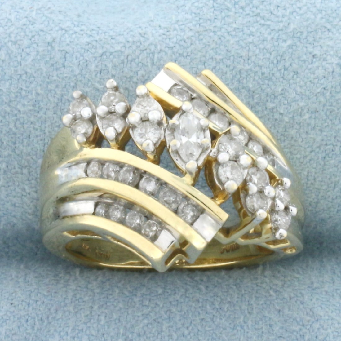 Vintage Marquise and Round Diamond Cocktail Ring in 14k Yellow Gold: In 14k Yellow Gold. Contains one 1/5ct marquise and thirty two round high quality diamonds, I color/I clarity. Total carat weight of diamonds is 1ct. 17mm wide at top. Size 7. 8.9g.