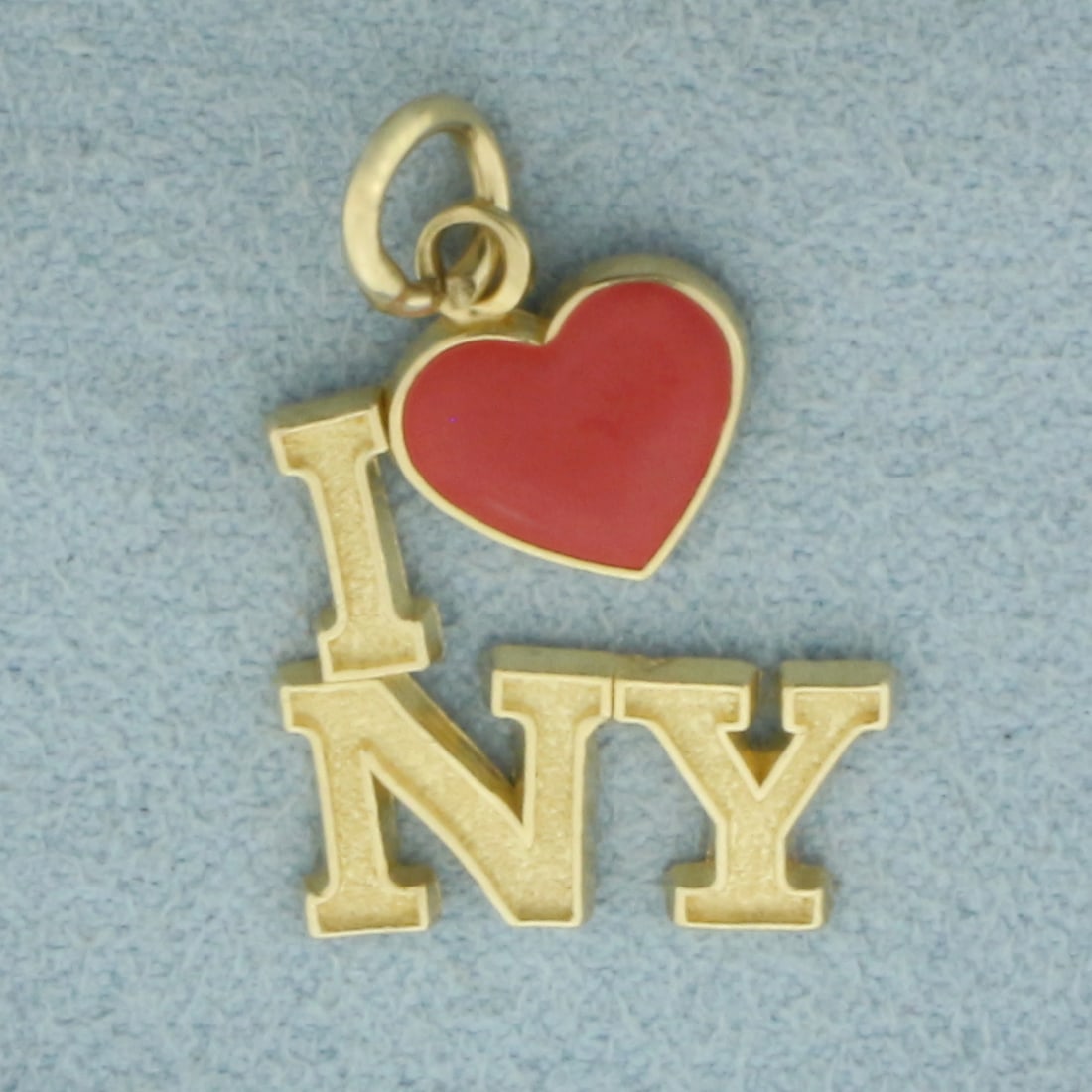Vintage I Love NY Charm in 14k Yellow Gold: In 14k Yellow Gold. 7/8 inch long (including jump ring). 5/8 inch wide. 1.5g.