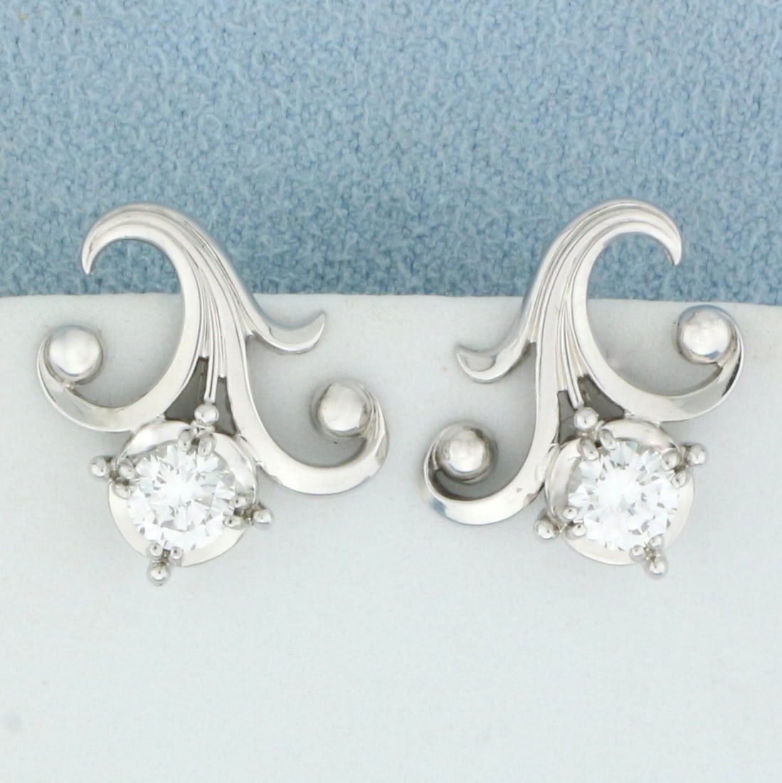 Diamond Fleur De Lis Screw Back Earrings in 18K White Gold: In 18K White Gold. Contains two high quality round brilliant Diamonds, 2/3ct TW, VS1 clarity/G color ,great cut for lots of sparkle. 5/8 inch long. 4.8g.