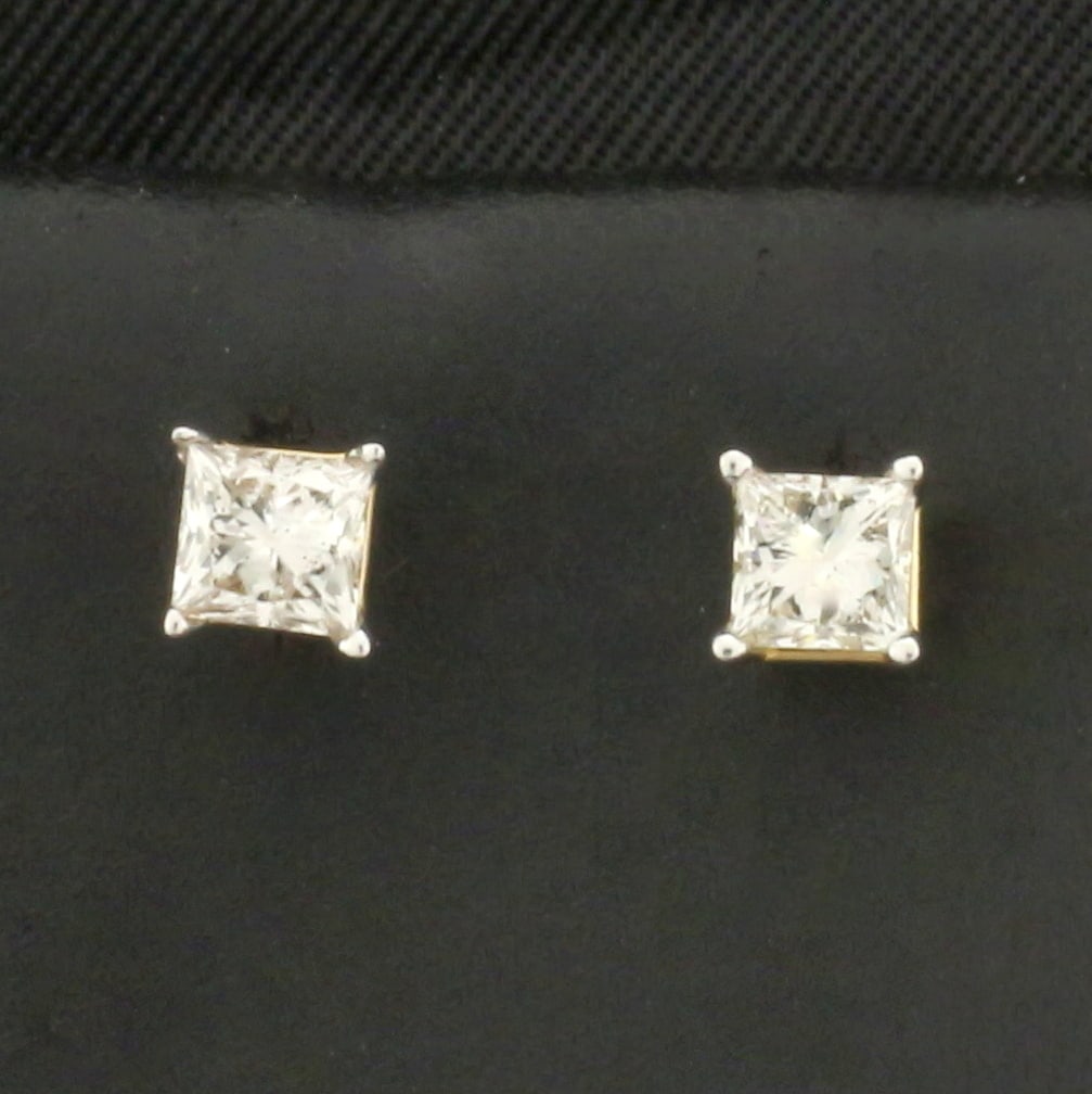 Princess Cut Diamond Stud Earrings in 14k Yellow Gold: In 14k Yellow Gold. Contains two high quality princess cut diamonds, 1/2ct TW, I color/I1 clarity, eye clean, great cut for added brilliance. Friction backs. .7g.