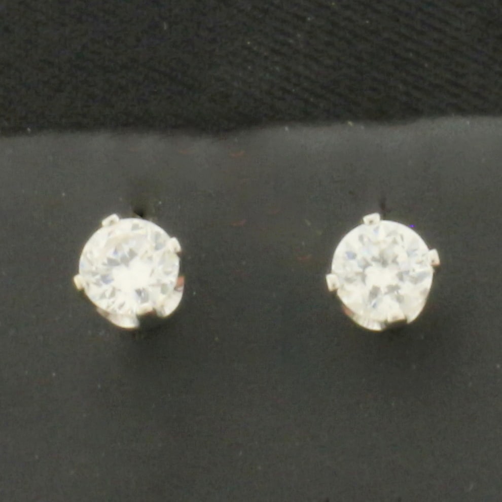 CZ Stud Earrings in 14k White Gold: In 14k White Gold. Contains two high quality CZ gemstones, 1/2ct TW, with excellent cut and clarity for added brilliance. Friction backs. .8g.