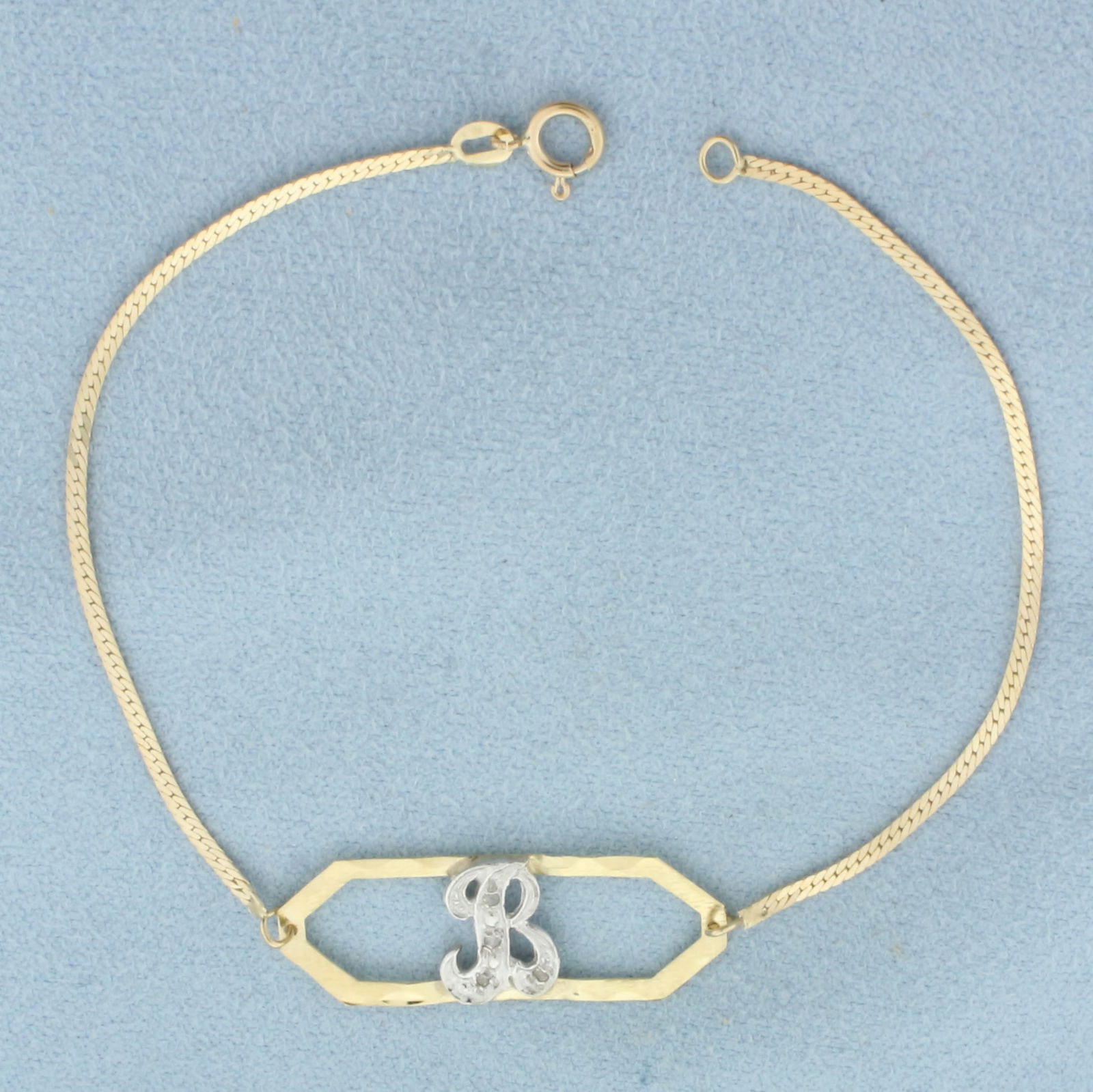 Diamond "B" Initial Monogram Bracelet in 14k Yellow Gold: In 14k Yellow Gold. Contains four high quality 1/2pt diamonds. 7 inches long. 3/8 inch wide at center. Spring clasp. 1.5g.