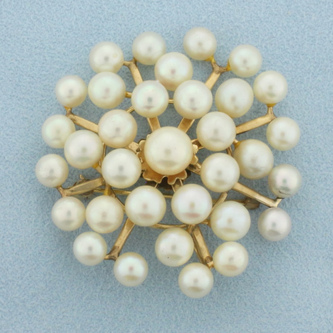 Ming's Designer Cultured Akoya Pearl Pendant or Brooch in 14k Yellow Gold: In 14k yellow gold, made by Ming's Hawaii. Contains high quality Akoya cultured pearls ranging 8mm 5.3mm each with high mirror like luster. Can be worn as a pendant or pin. Aprox.1 5/8 inch x 1 3/4 in