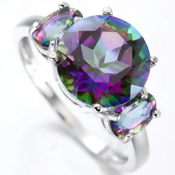 Mystic Topaz 3-Stone Ring in Sterling Silver: In platinum over .925 sterling silver. Contains one 3.5ct mystic topaz gemstone and two .39ct mystic topaz gemstones. Total gemstone weight is 4.28ctw. Size 7. 2.8g