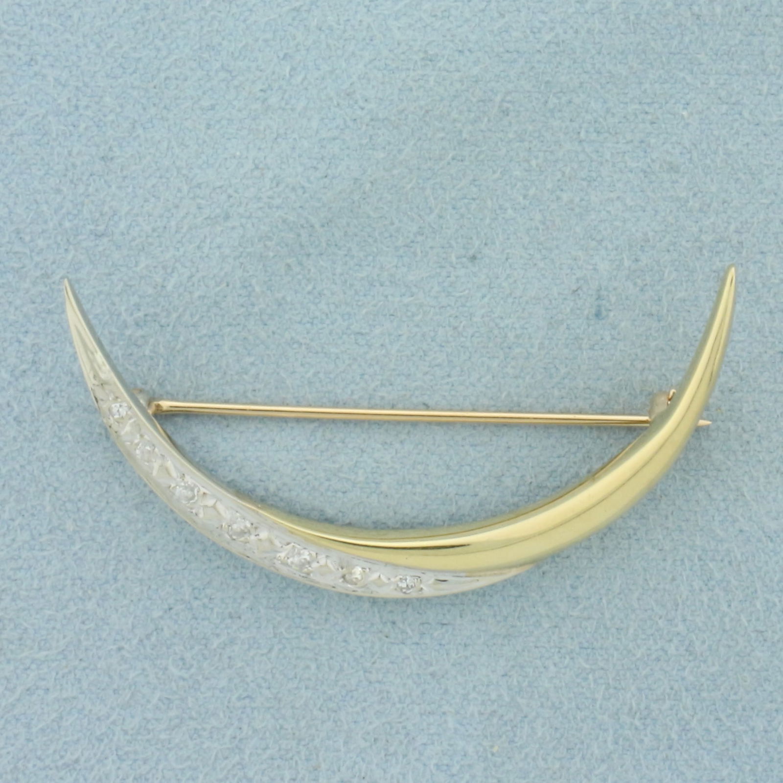 Vintage Diamond Crescent Moon Brooch Pin in 14k Yellow and White Gold: In 14k Yellow and White Gold. Contains seven high quality diamonds, 1/10ct TW, VS clarity/H color. 1 5/8 inch long. 7/8 inch wide. 3.5g.