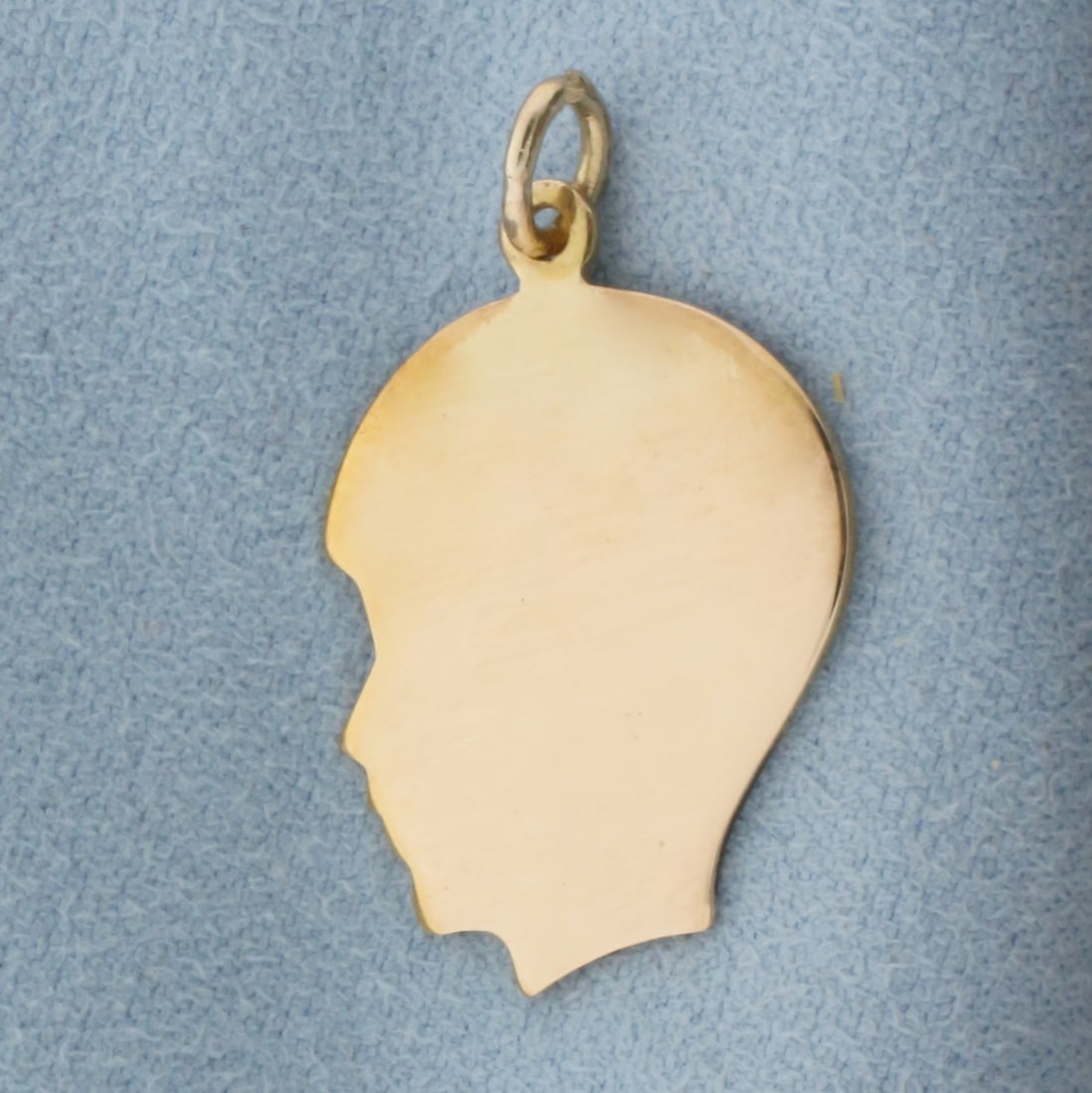 Engravable Boy Silhouette Charm in 14k Yellow Gold: In 14k Yellow Gold. 1 1/8 inch long (including jump ring). 5/8 inch wide. 2.0g.