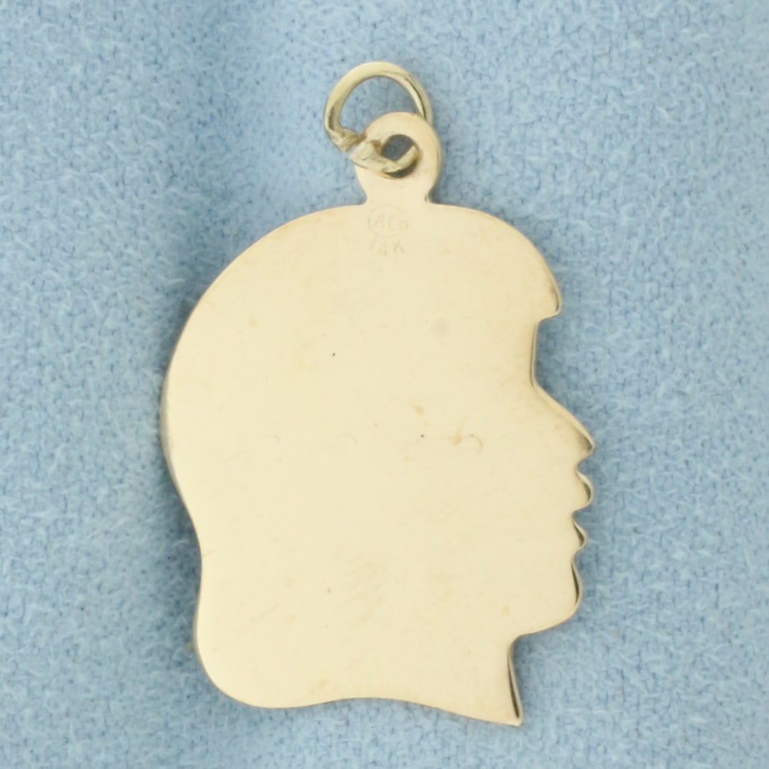 Engravable Girl Silhouette Charm in 14k Yellow Gold: In 14k Yellow Gold. 1 inch long (including jump ring). 3/4 inch wide. 2.1g.