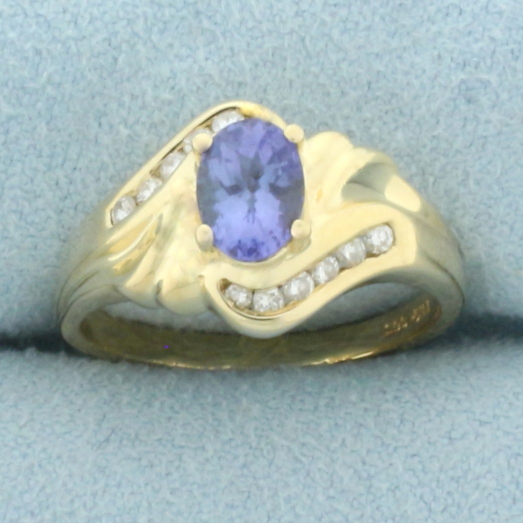 Tanzanite and Diamond Ring in 14k Yellow Gold: In 14k yellow gold. Contains one high quality natural 1ct oval cut tanzanite gemstone with vibrant color and excellent clarity. Accented by twelve .01ct high quality diamonds, VS clarity/H color.