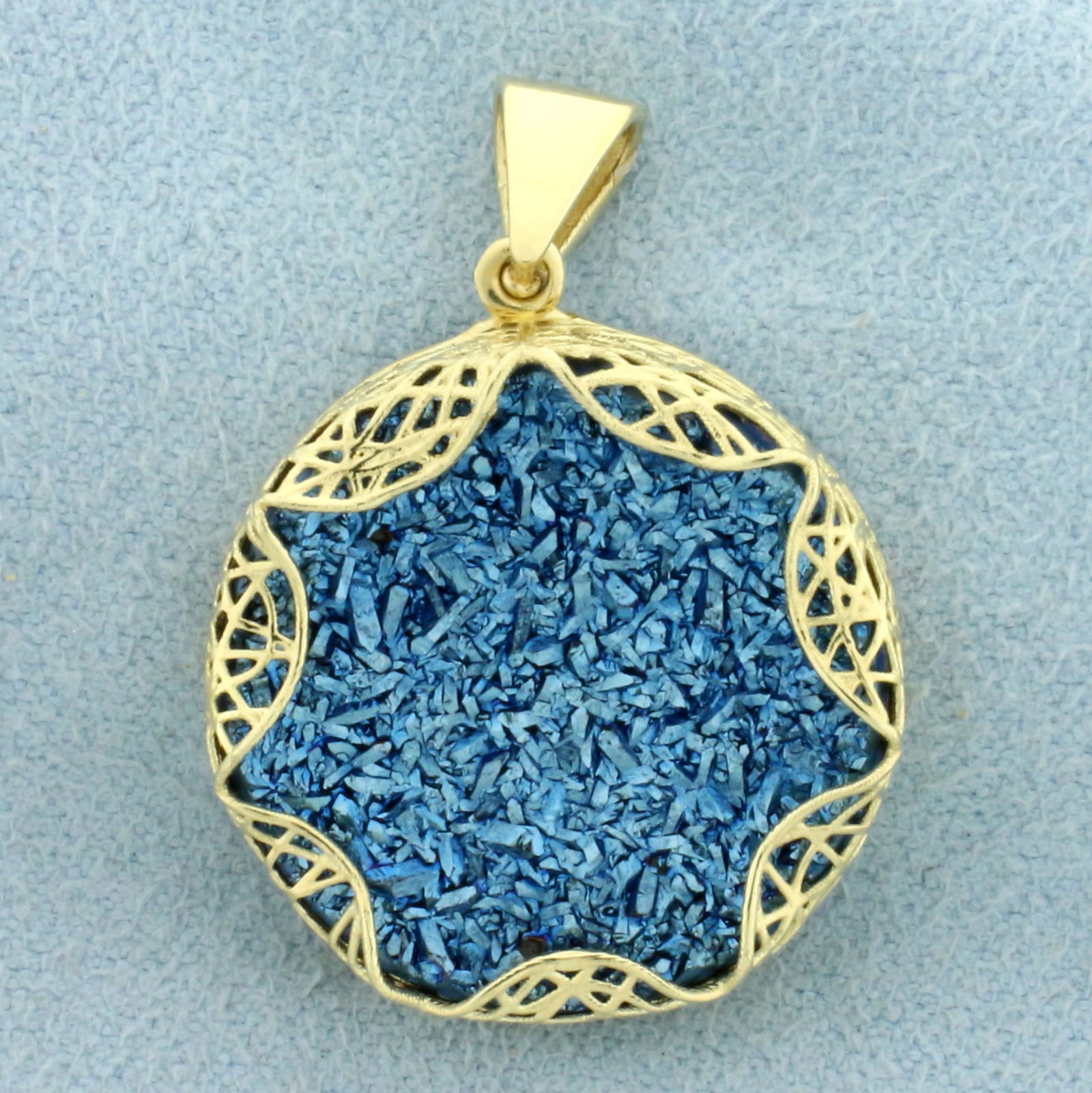 Blue Druzy Quartz Statement Pendant in 14k Yellow Gold: In 14k yellow. Contains blue, reflective druzy quartz. 1 1/8 inches long, 13/16 inch wide. 3.9g.